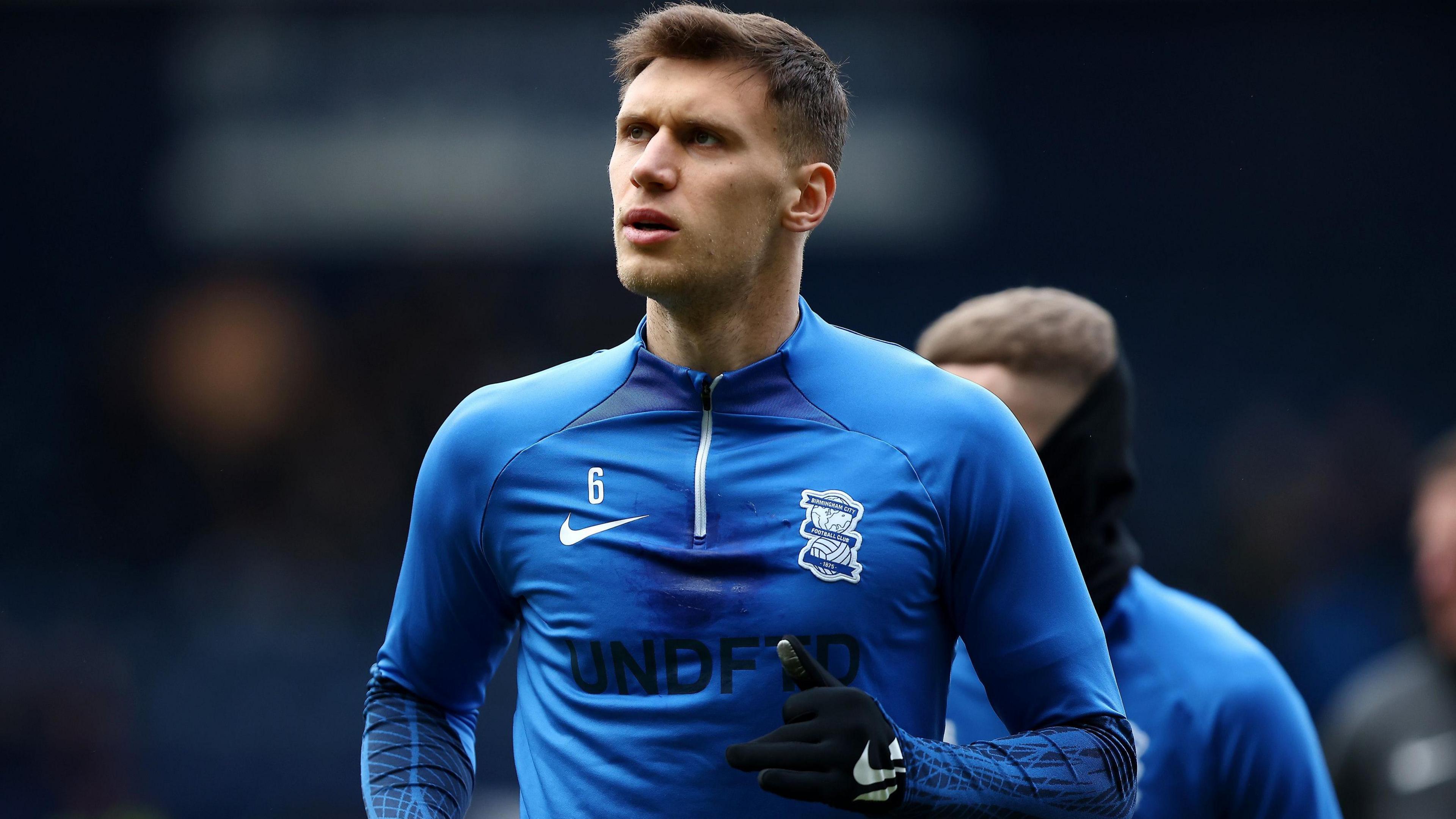 Krystian Bielik warming up for Birmingham City