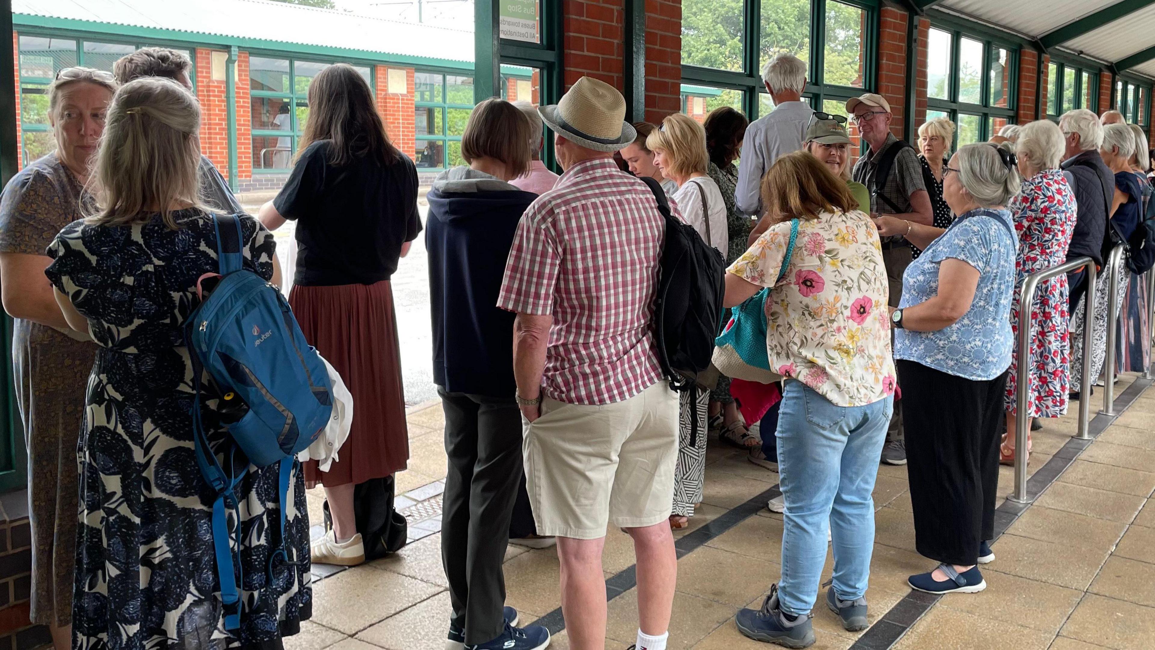 A queue of ticket-holders for the event at the Meadowhall Interchange coach station.