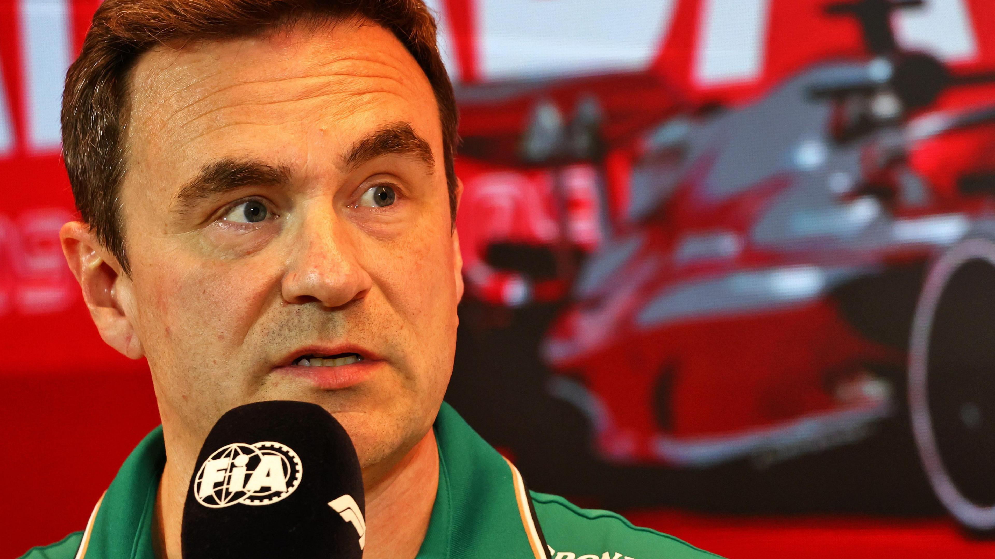 Dan Fallows speaking into an FIA-branded microphone