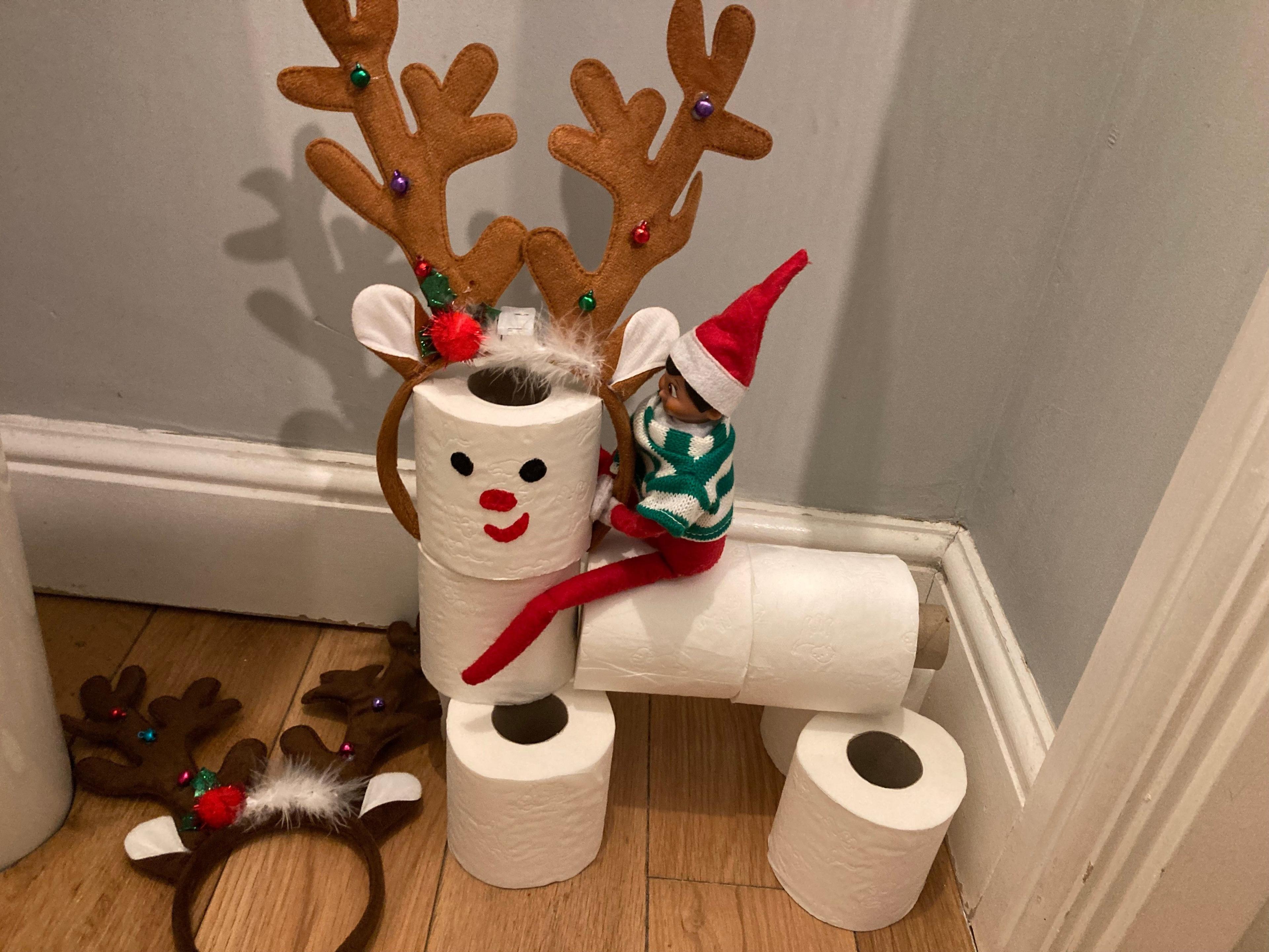 A rudolf the red nose reindeer out of toilet paper.