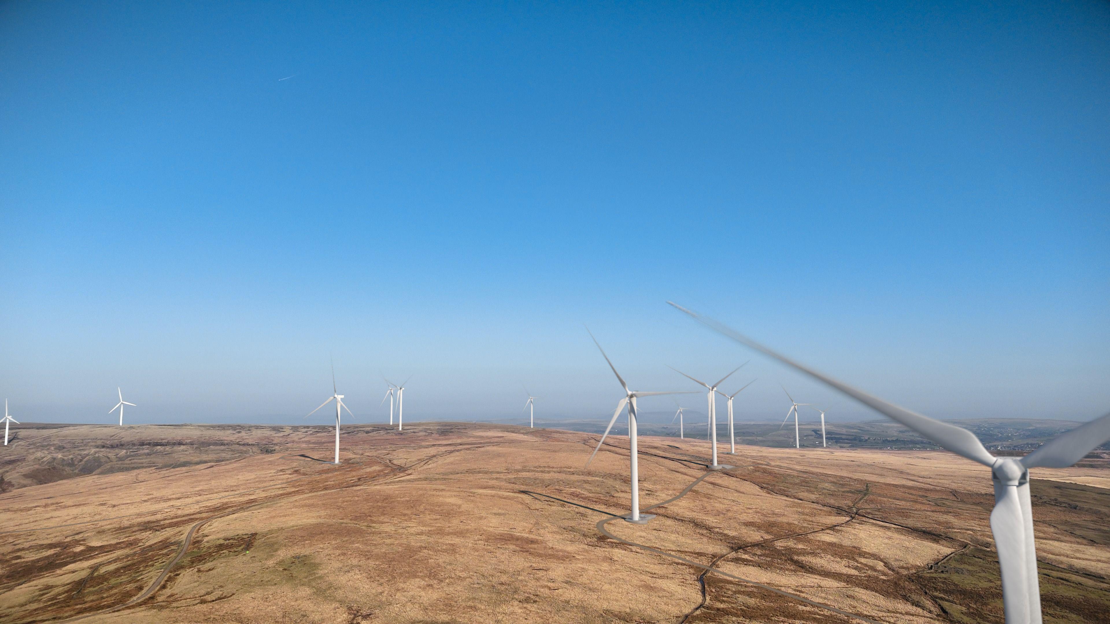 Large white wind turbines can be seen spread across the landscape in this computer generated image.