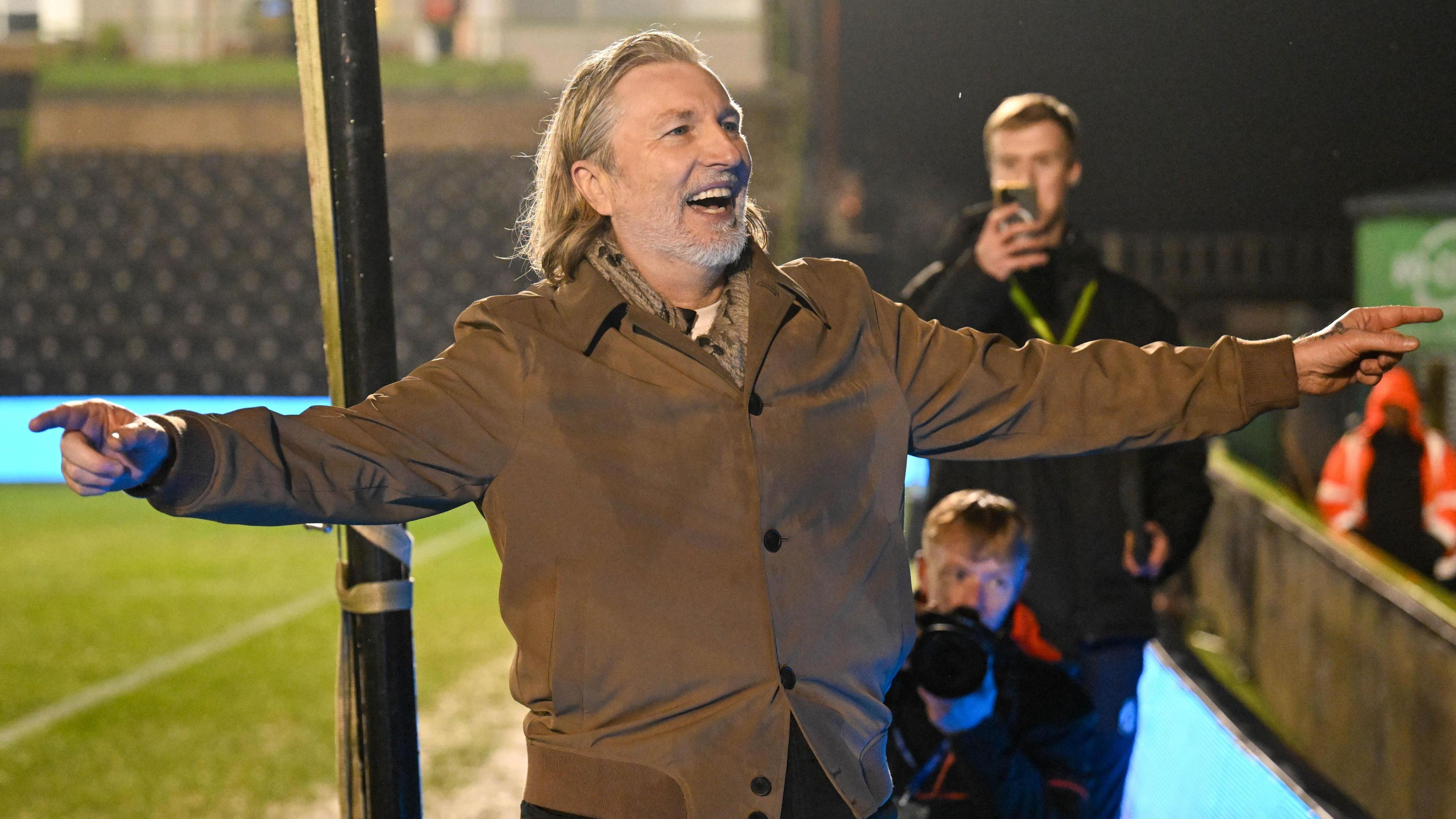 Robbie Savage celebrates with Forest Green Rovers supporters