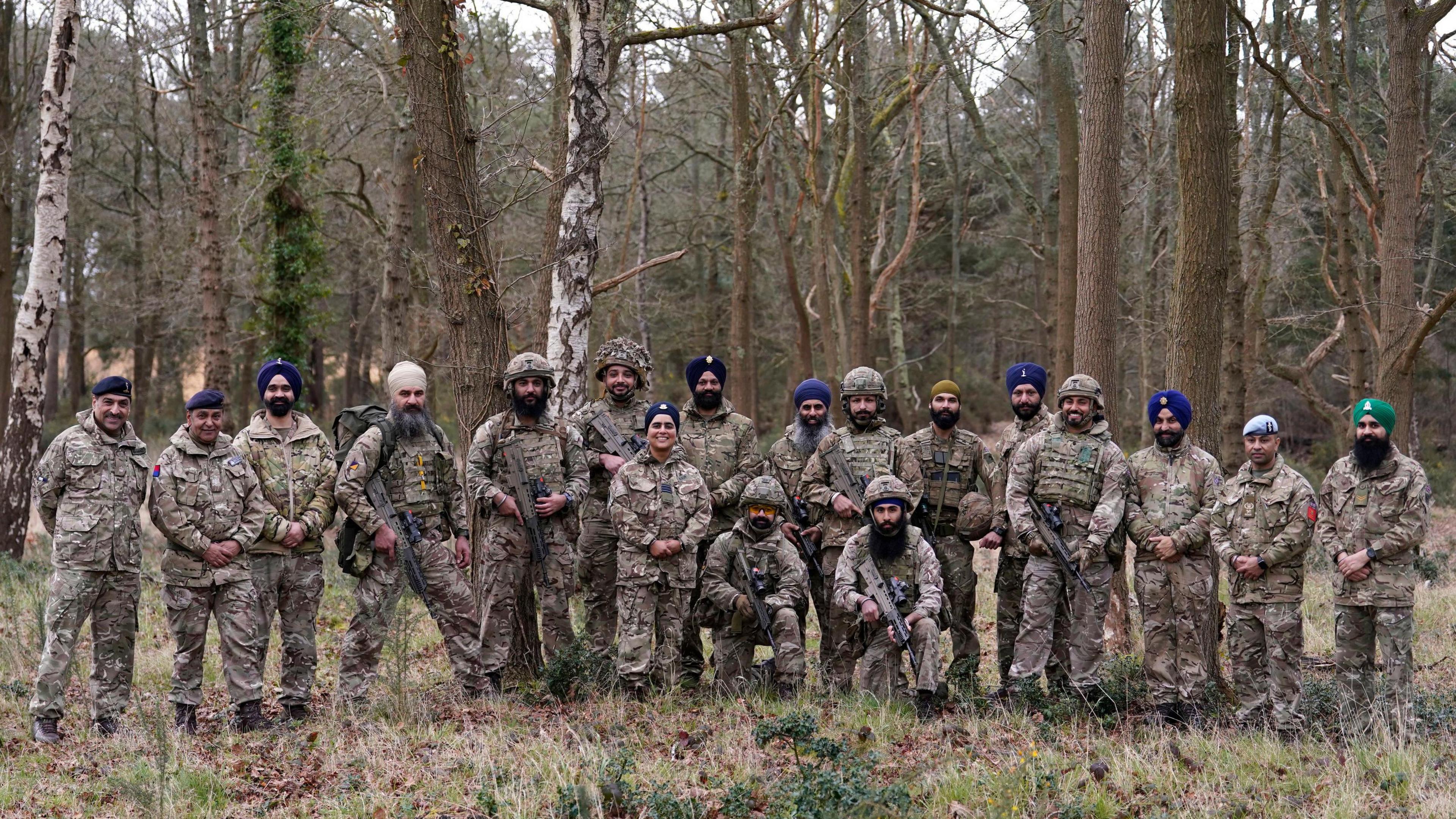 Sikh soldiers of the British Army pose for a photograph after competing in a shooting competition during the Holla Mahalla Sikh military festival, at the Aldershot Garrison, Hampshire