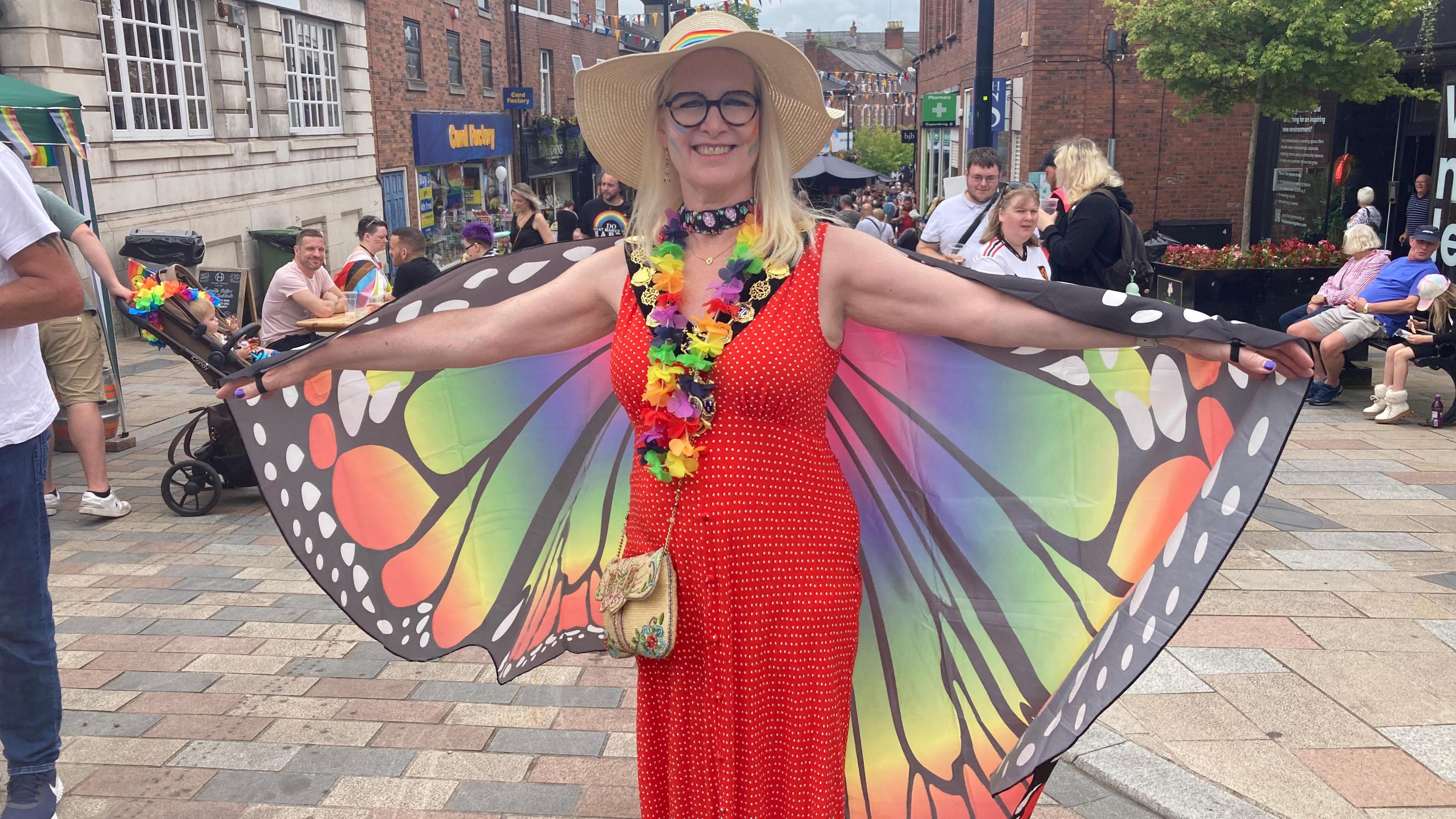 The Mayor of Congleton Kay Wesley wearing rainbow butterfly wings for Congleton Pride