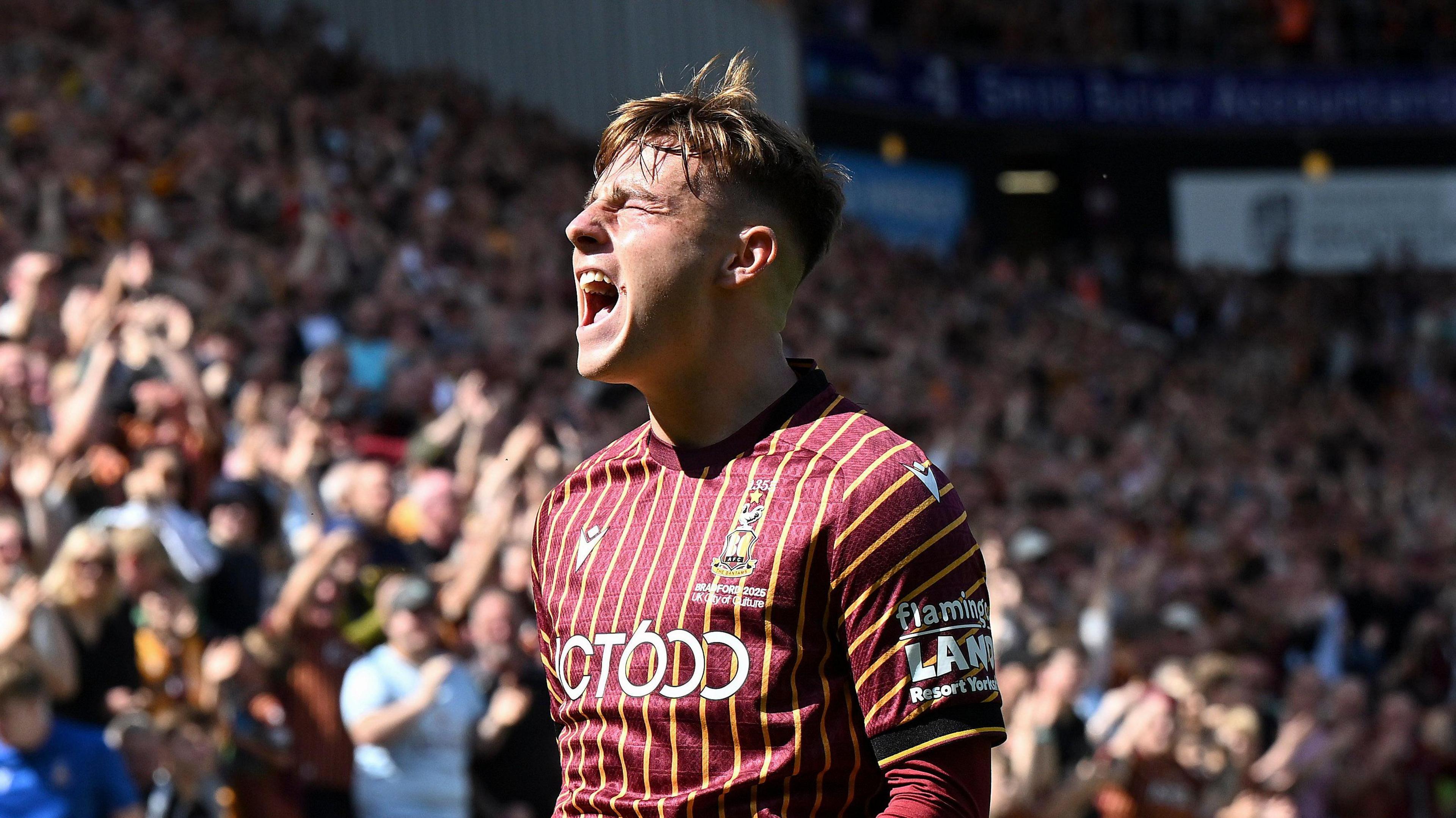 Bobby Pointon closes his eyes and has his mouth open after scoring a goal