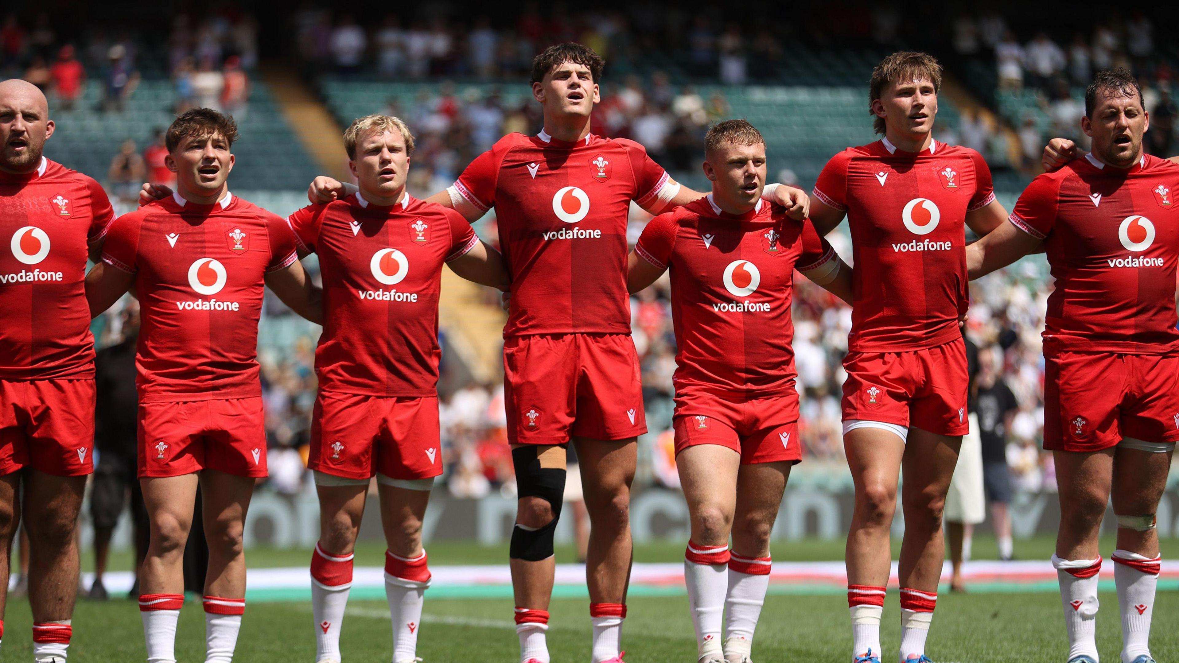 Wales players line up for the anthem against Barbarians 
