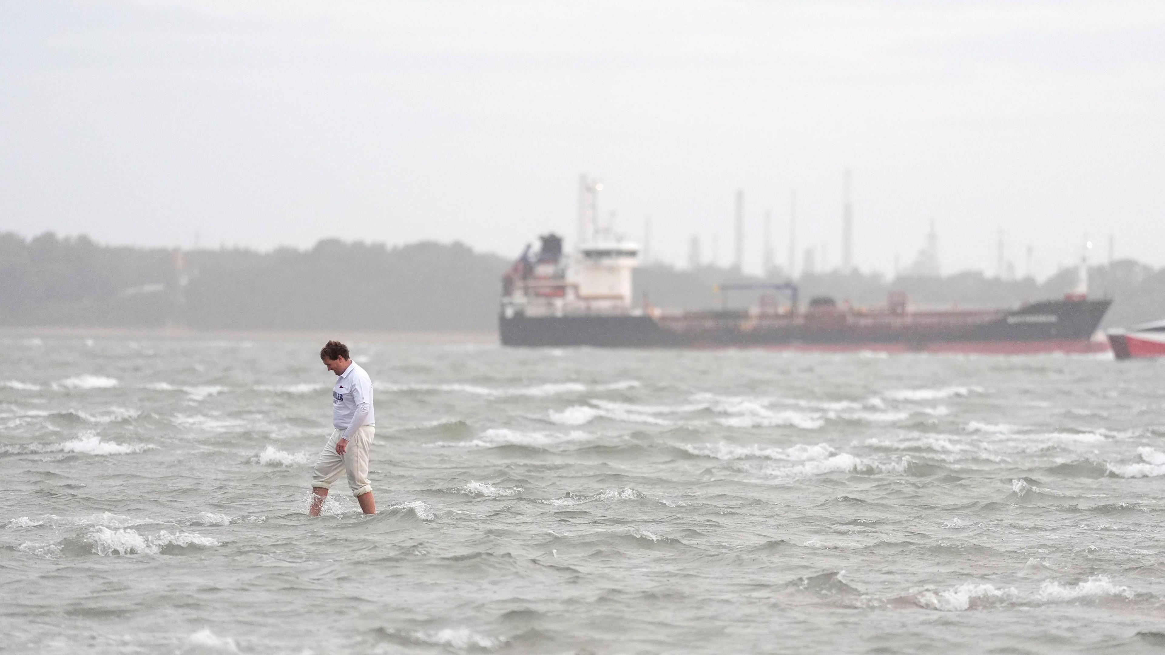 Members of the Royal Southern Yacht Club and the Island Sailing Club take part in the annual Brambles cricket match on the Bramble Bank sandbank in the middle of the Solent at low tide