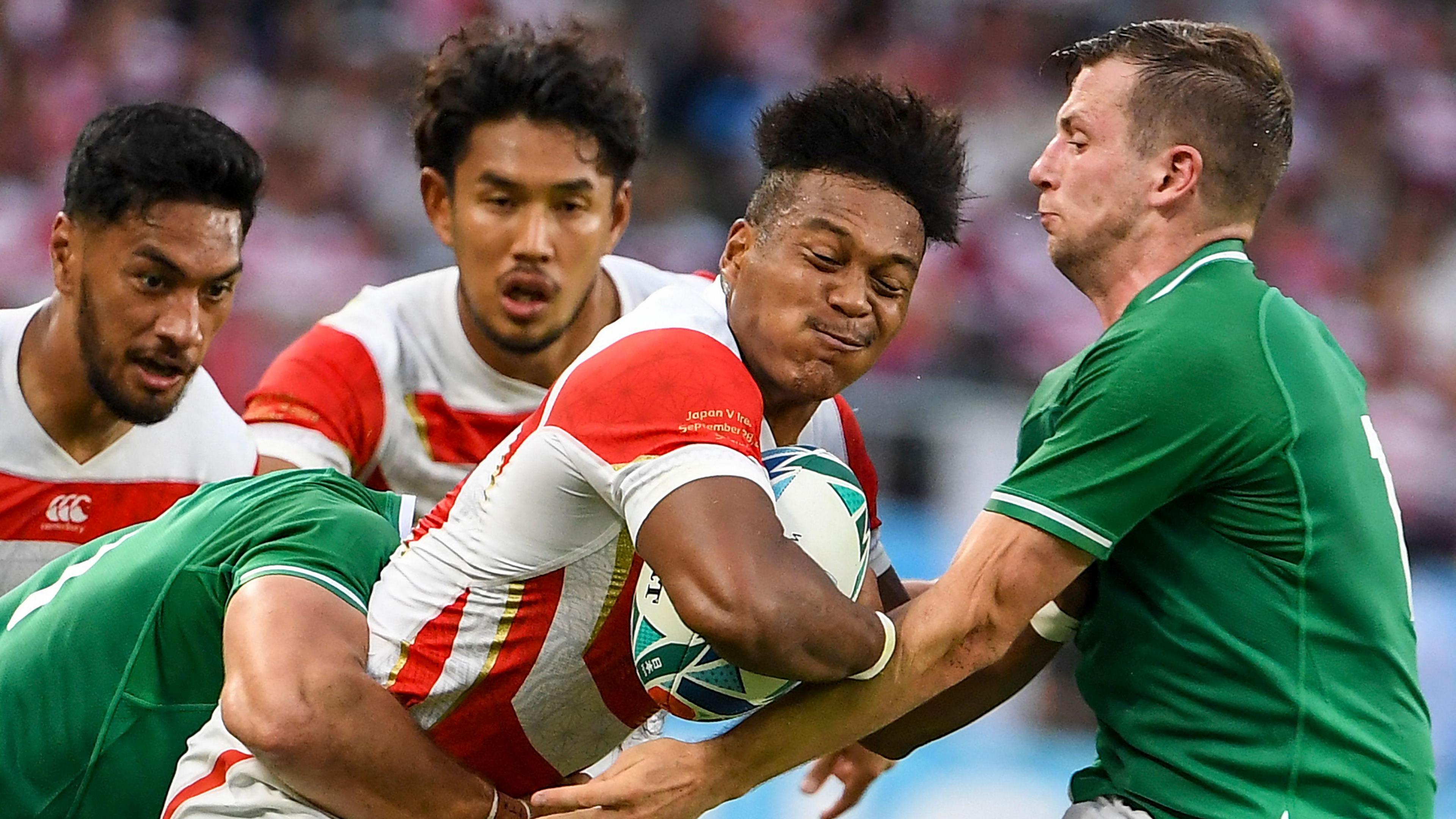 Japan's wing Kotaro Matsushima is tackled by Jack Carty