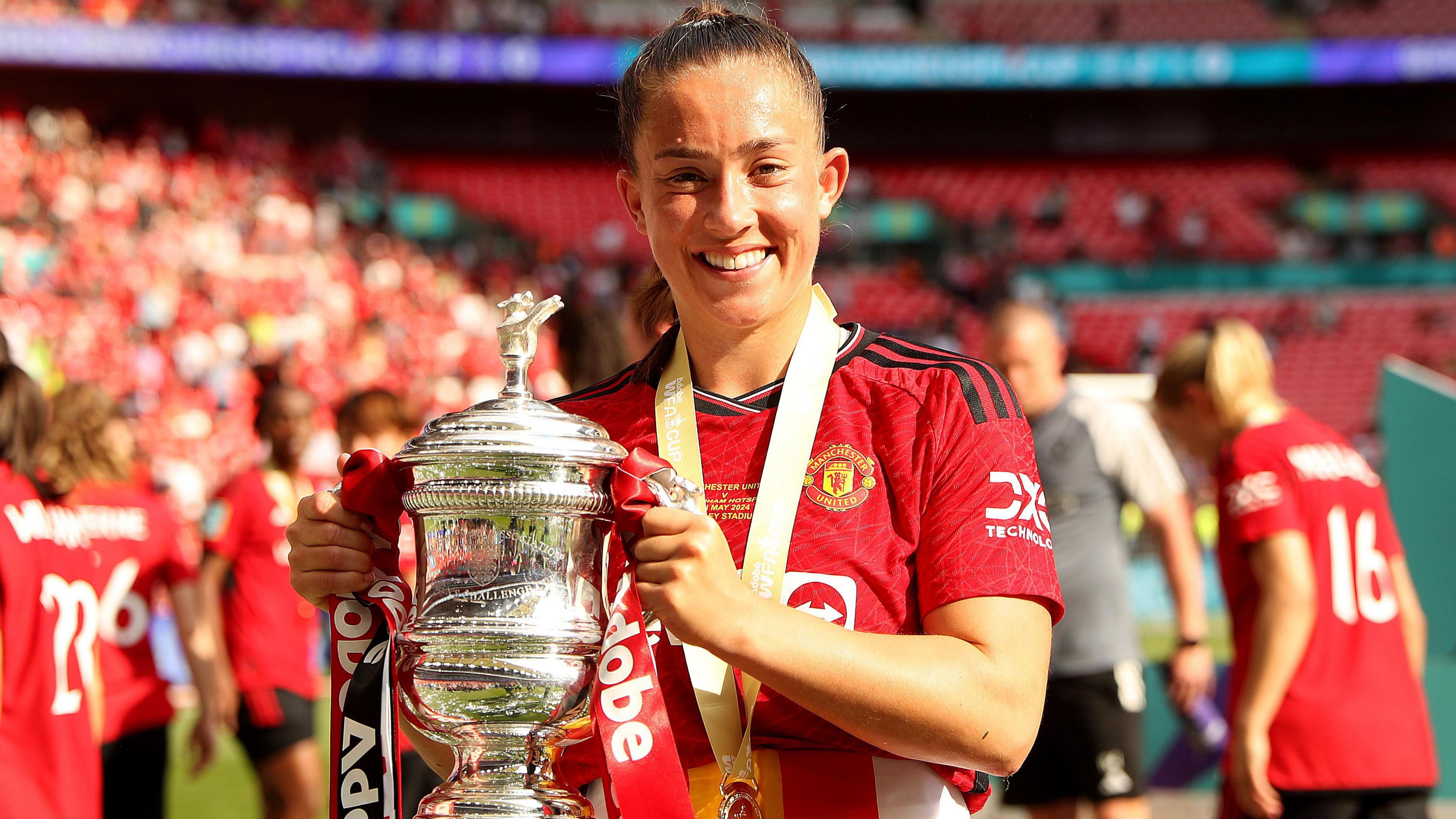 Maya Le Tissier holds the FA Cup