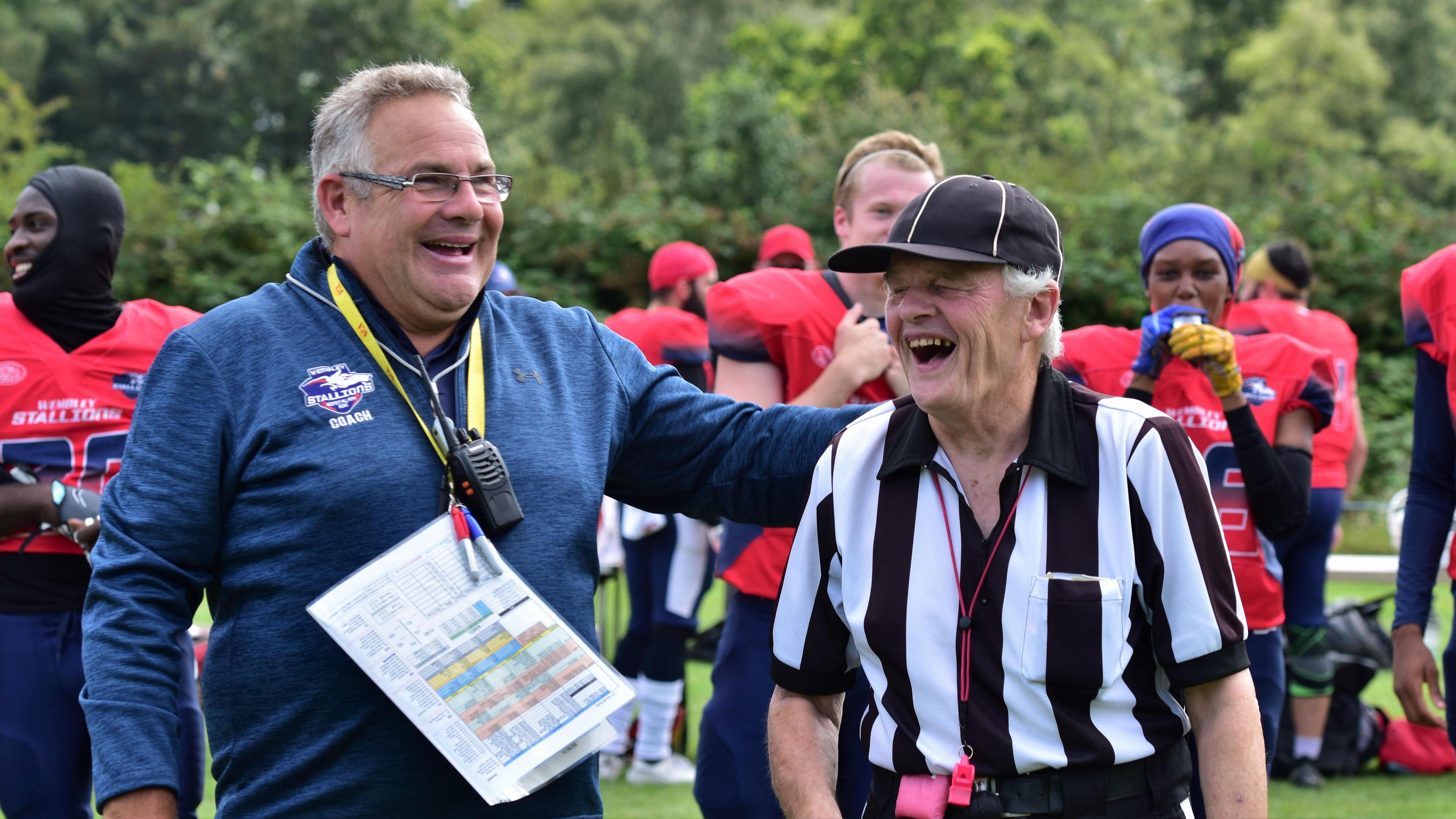 Warren Smart [left] laughs with a referee at a Wembley Stallions game