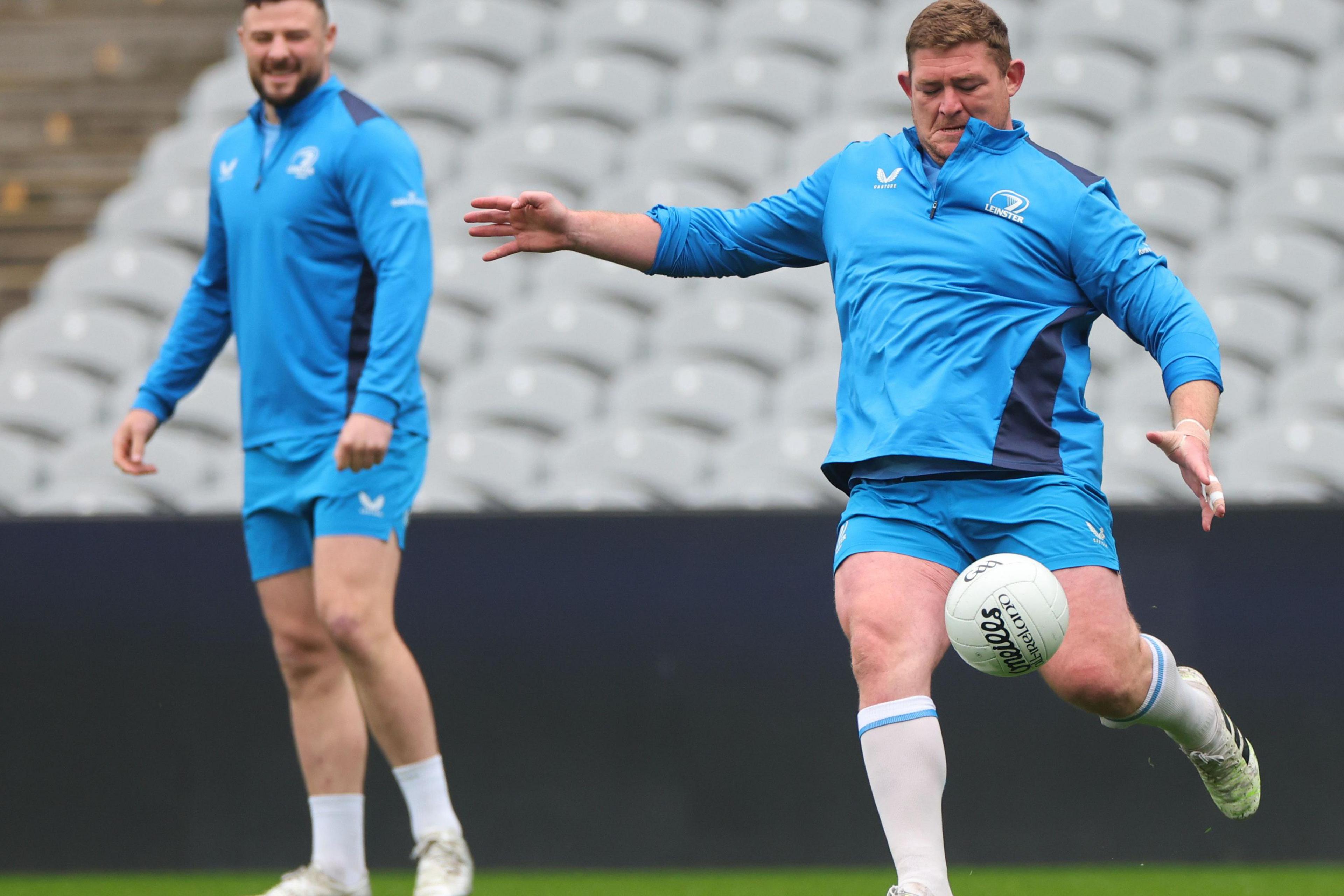 Tadhg Furlong kicks a gaelic football at Friday's captain's run at Croke Park