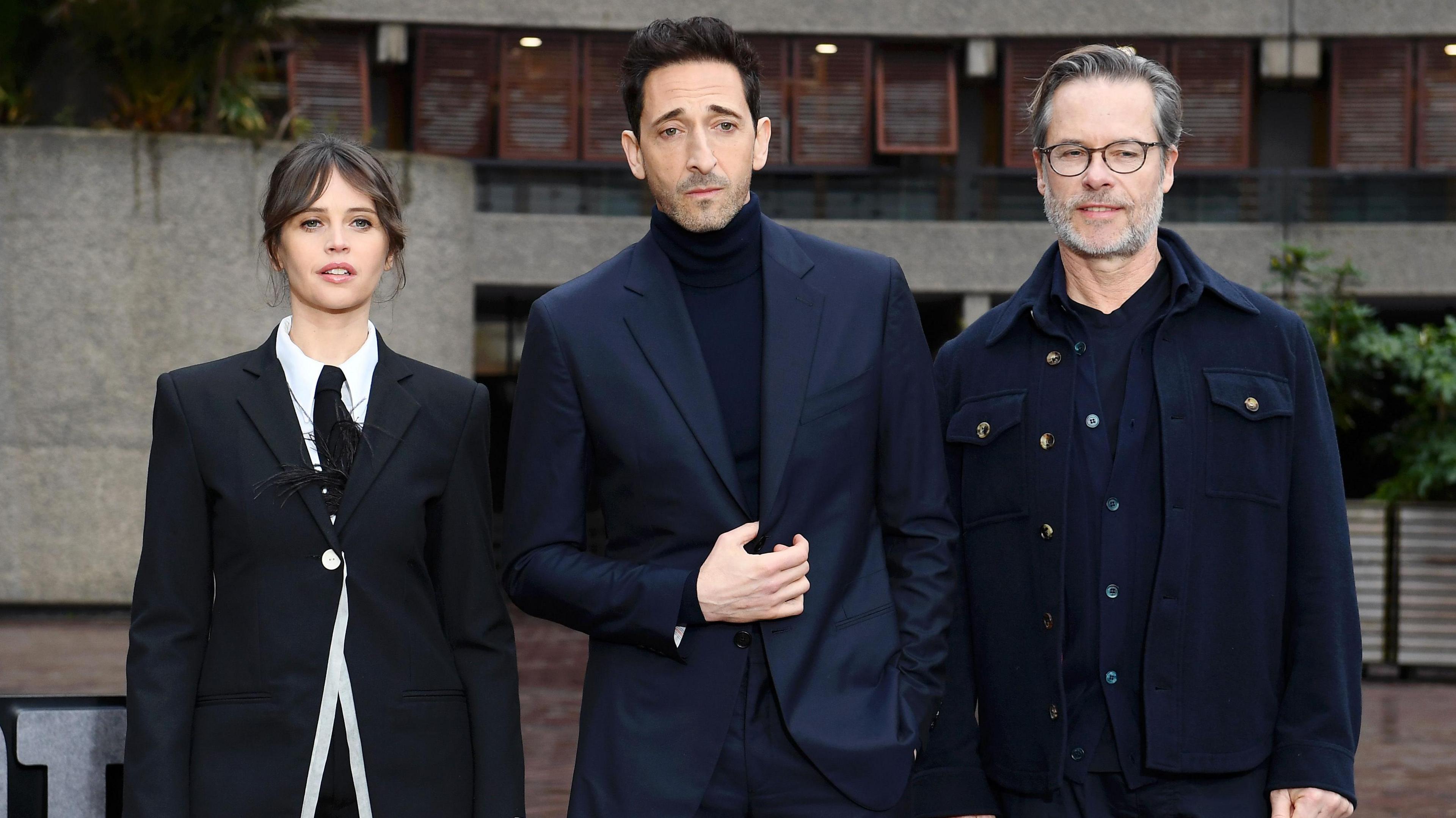 Felicity Jones, Adrien Brody and Guy Pearce attend "The Brutalist" photocall at The Barbican Centre on January 15, 2025 in London
