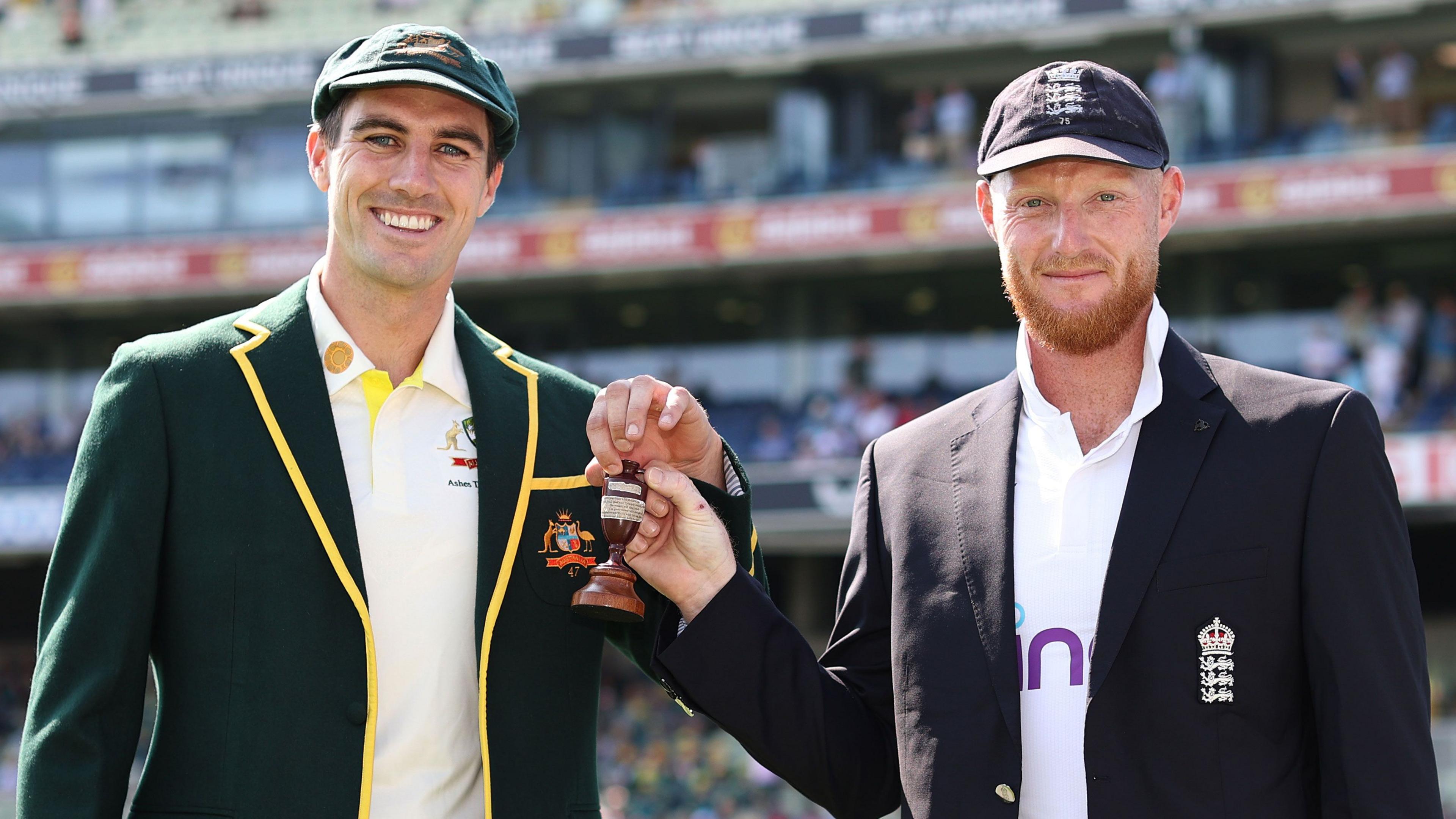 Pat Cummins and Ben Stokes with the Ashes urn