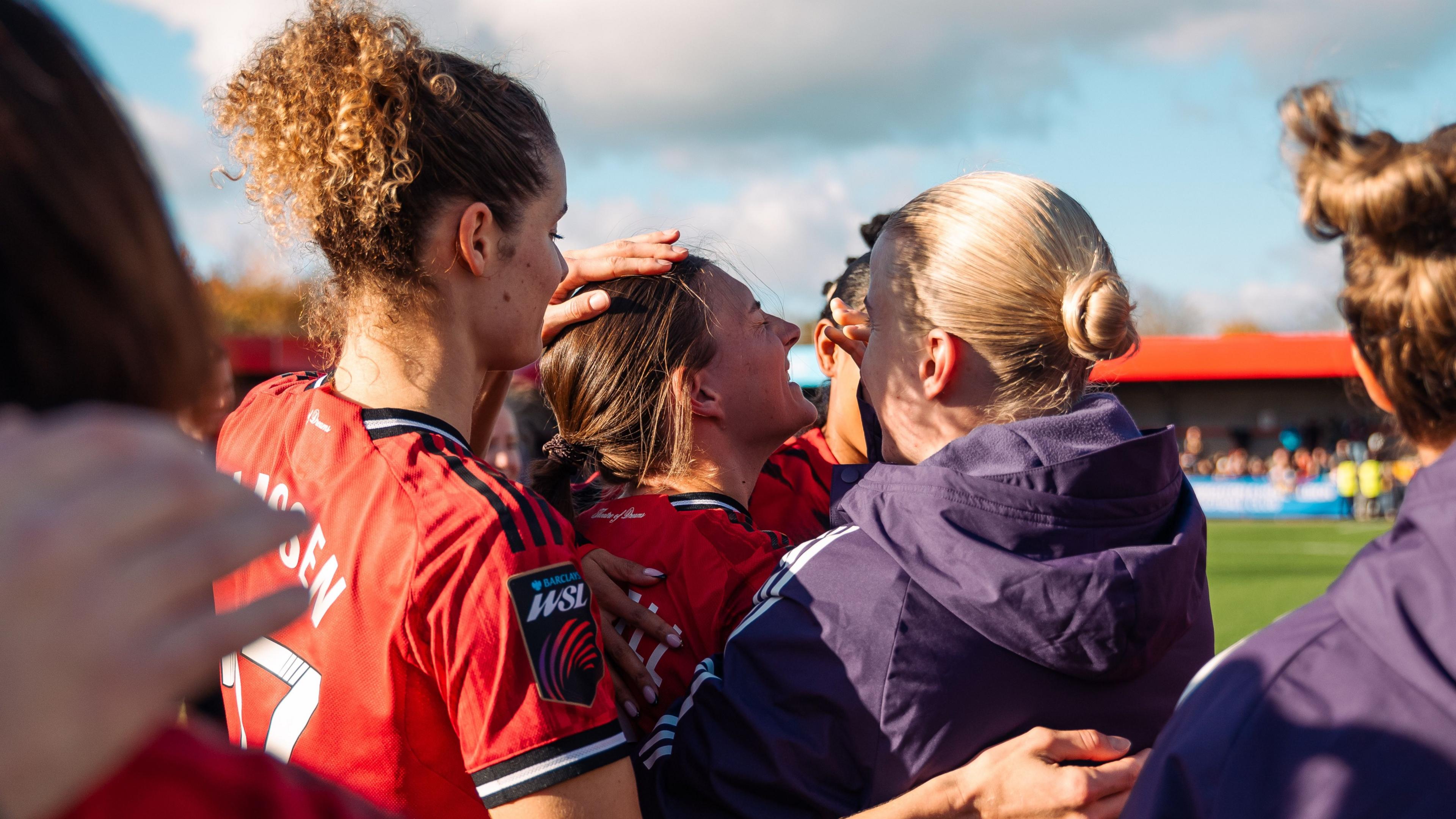 Hannah Blundell of Manchester United interacts with teammates