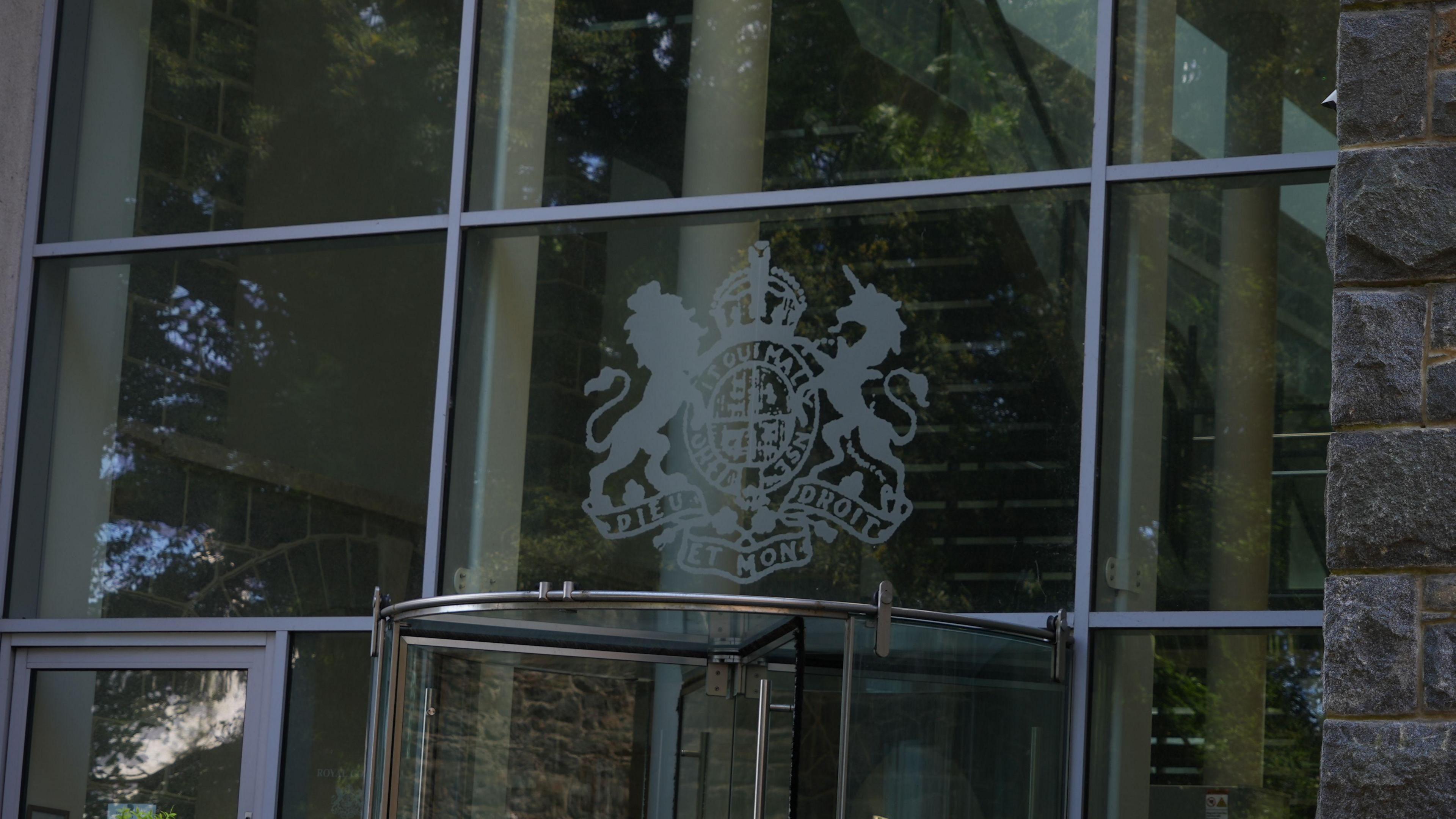 Guernsey Royal Court building St Peter Port Guernsey. Photo shows the glass doors to the court.