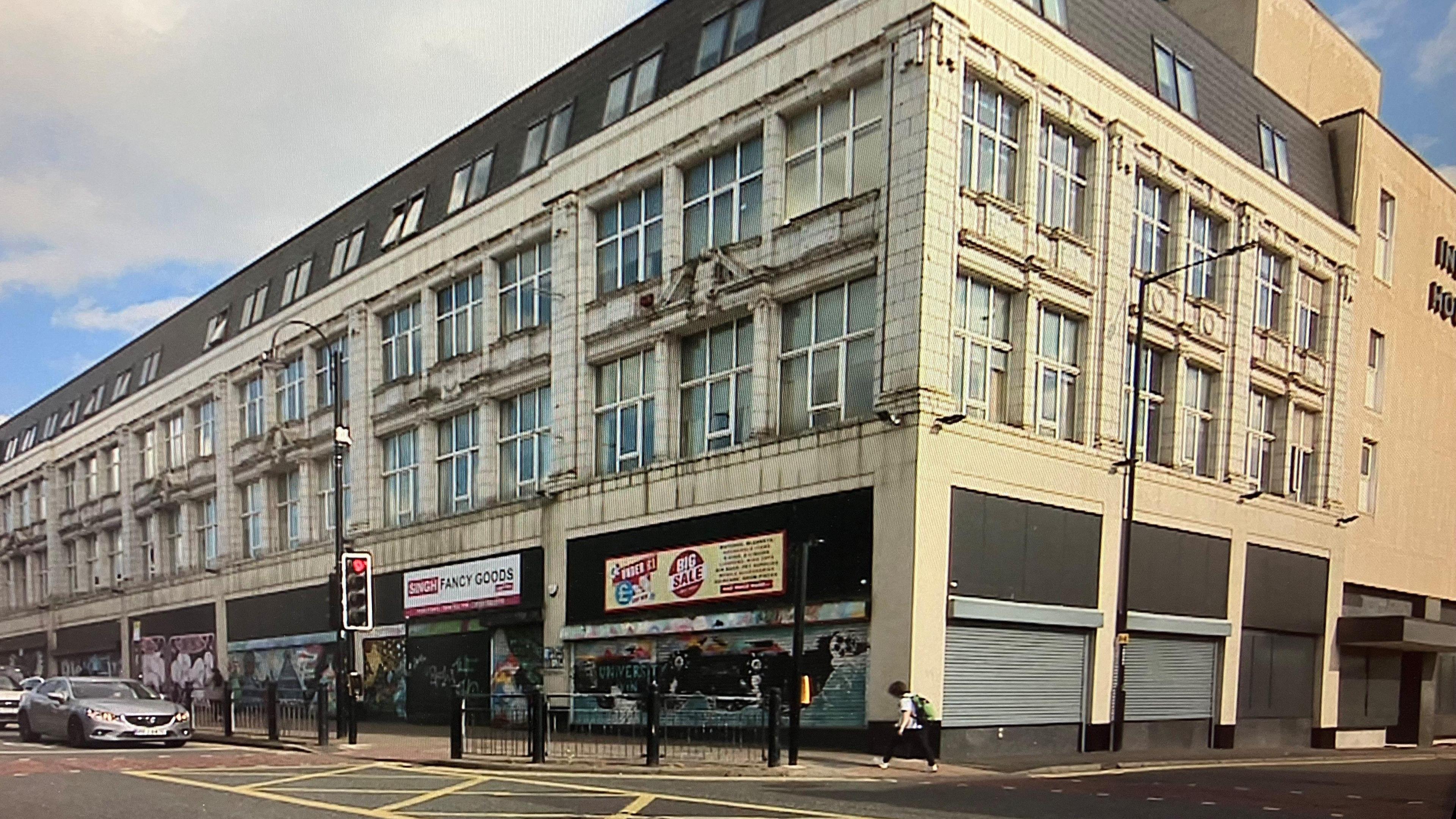 The former JT Parrish department store on Shields Road. Much of the building looks closed. 