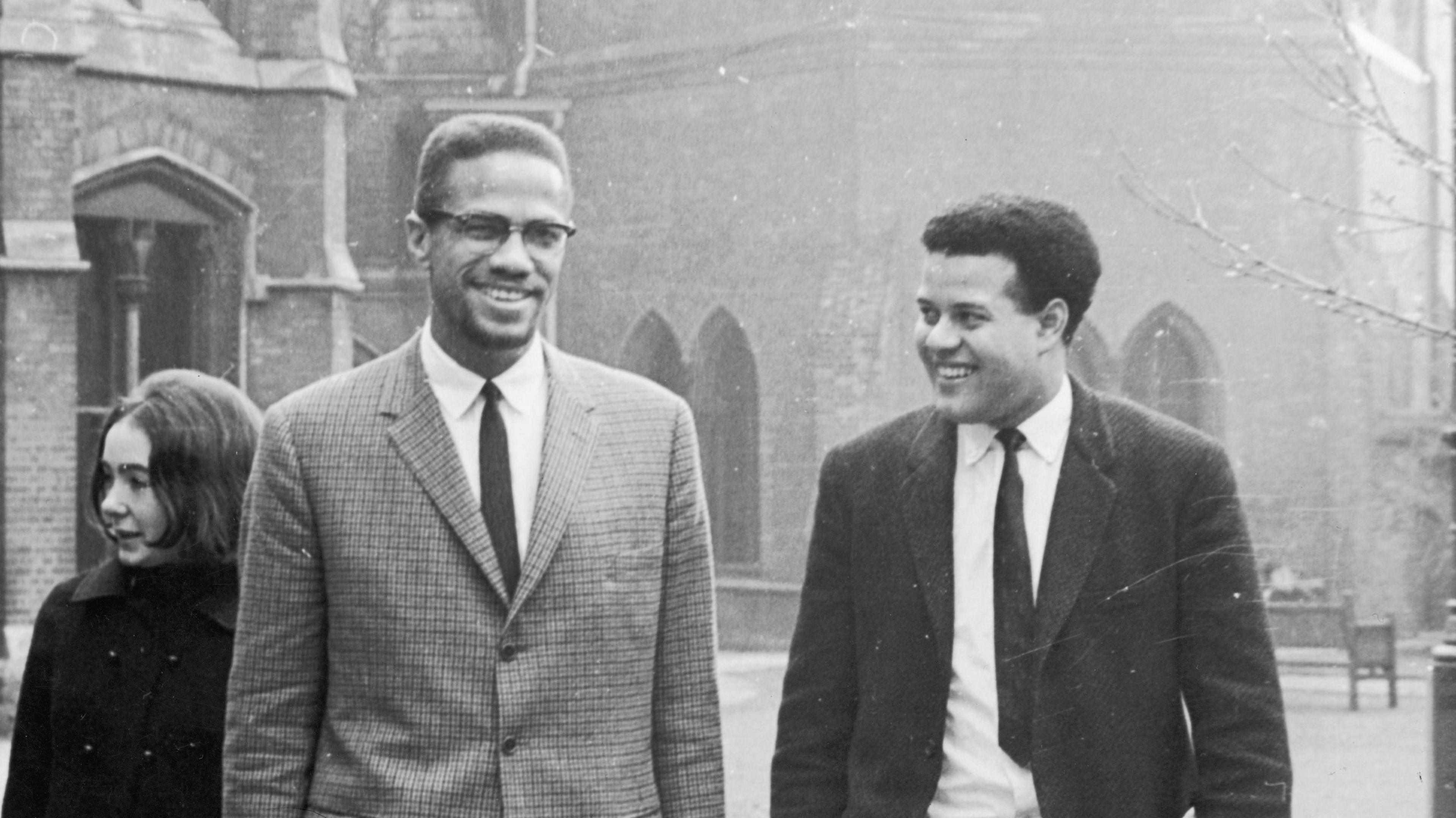 Black Nationalist leader and Nation of Islam spokesman Malcolm X in Oxford with Eric Abrahams, right, the Student Union president, before addressing university students.