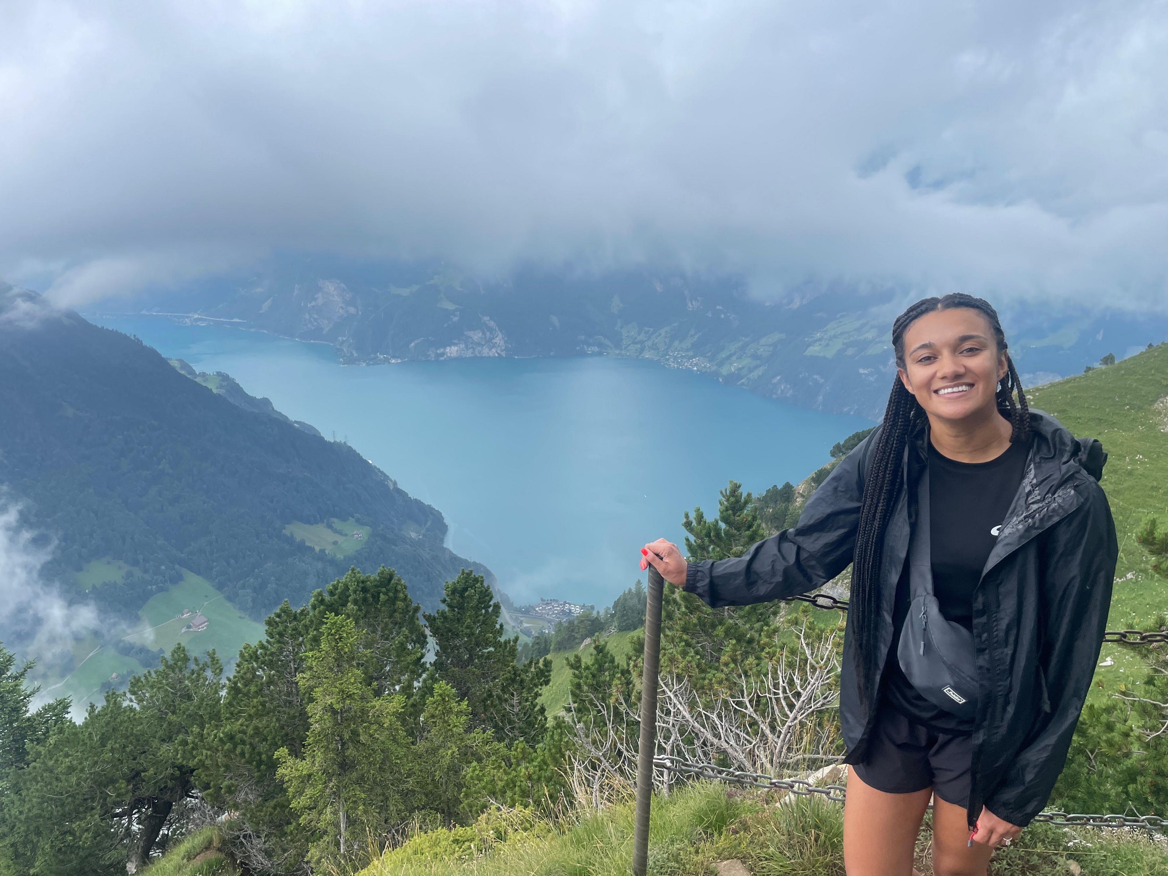 Nina Blissett in Switzerland with lake behind