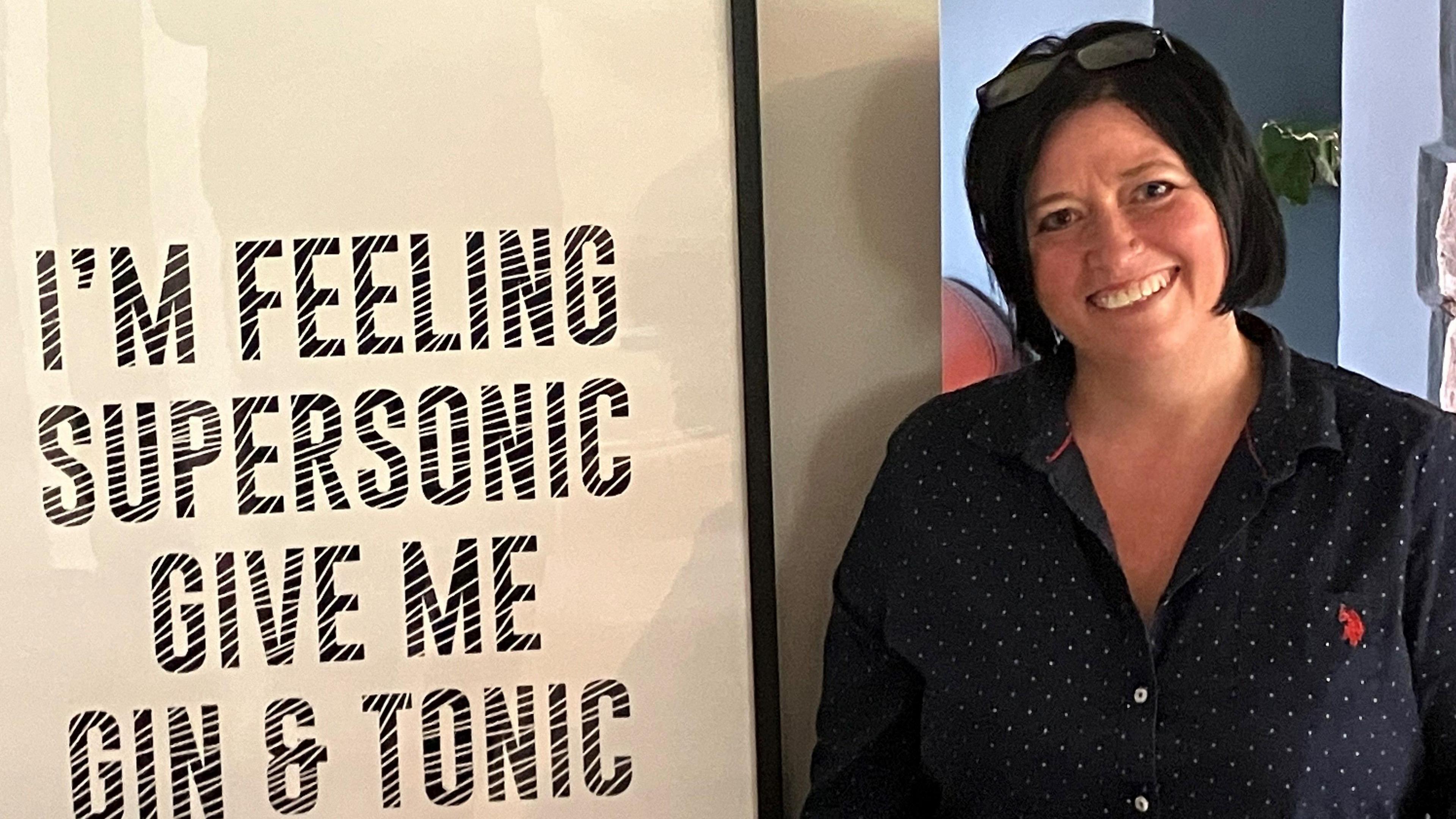 Monnow Valley Studio owner Jo Riou with a picture of lyrics from the Oasis debut single Supersonic which was recorded at the studio in Monmouth