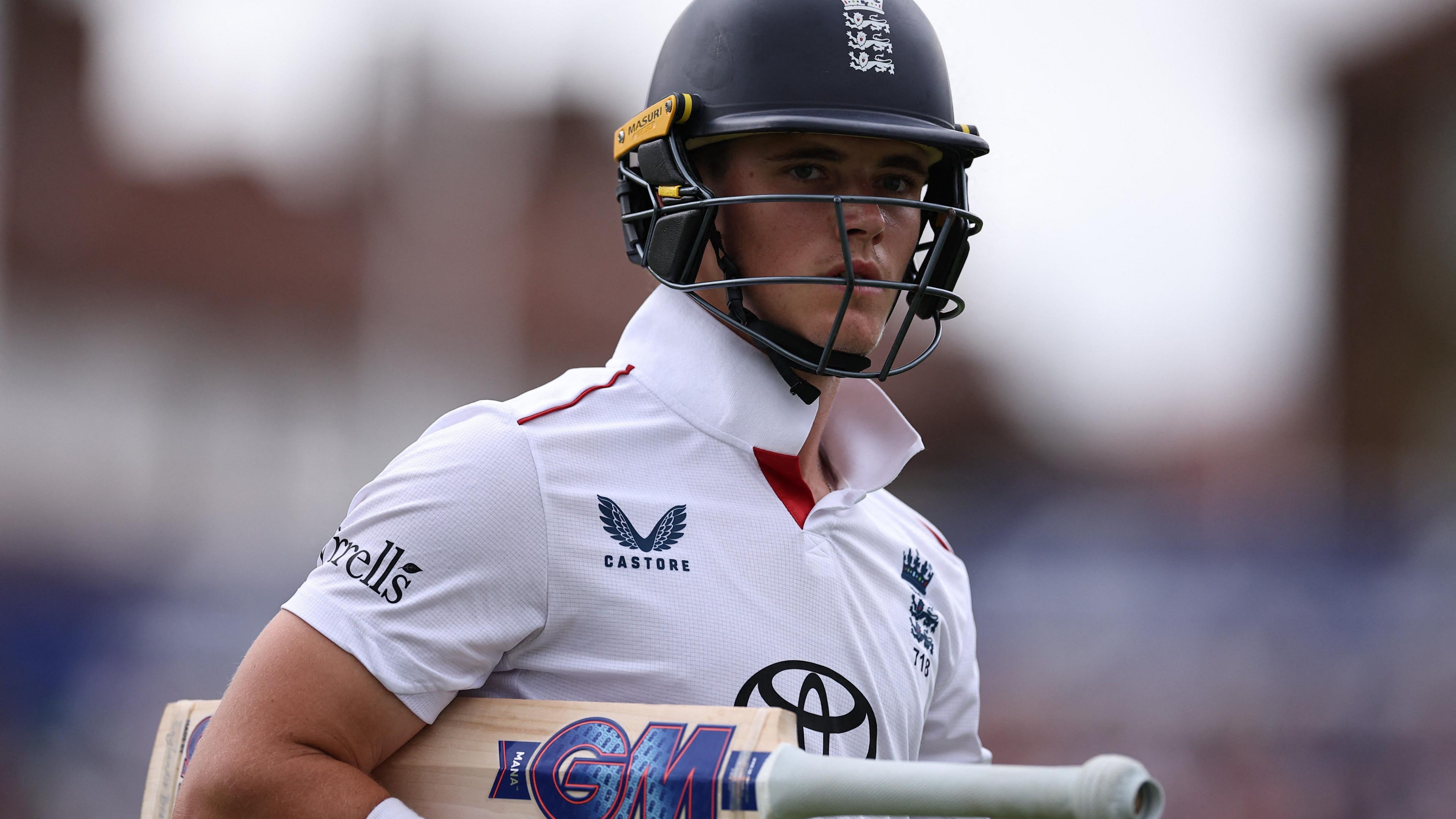 Jacob Bethell walks off with his bat under his arm