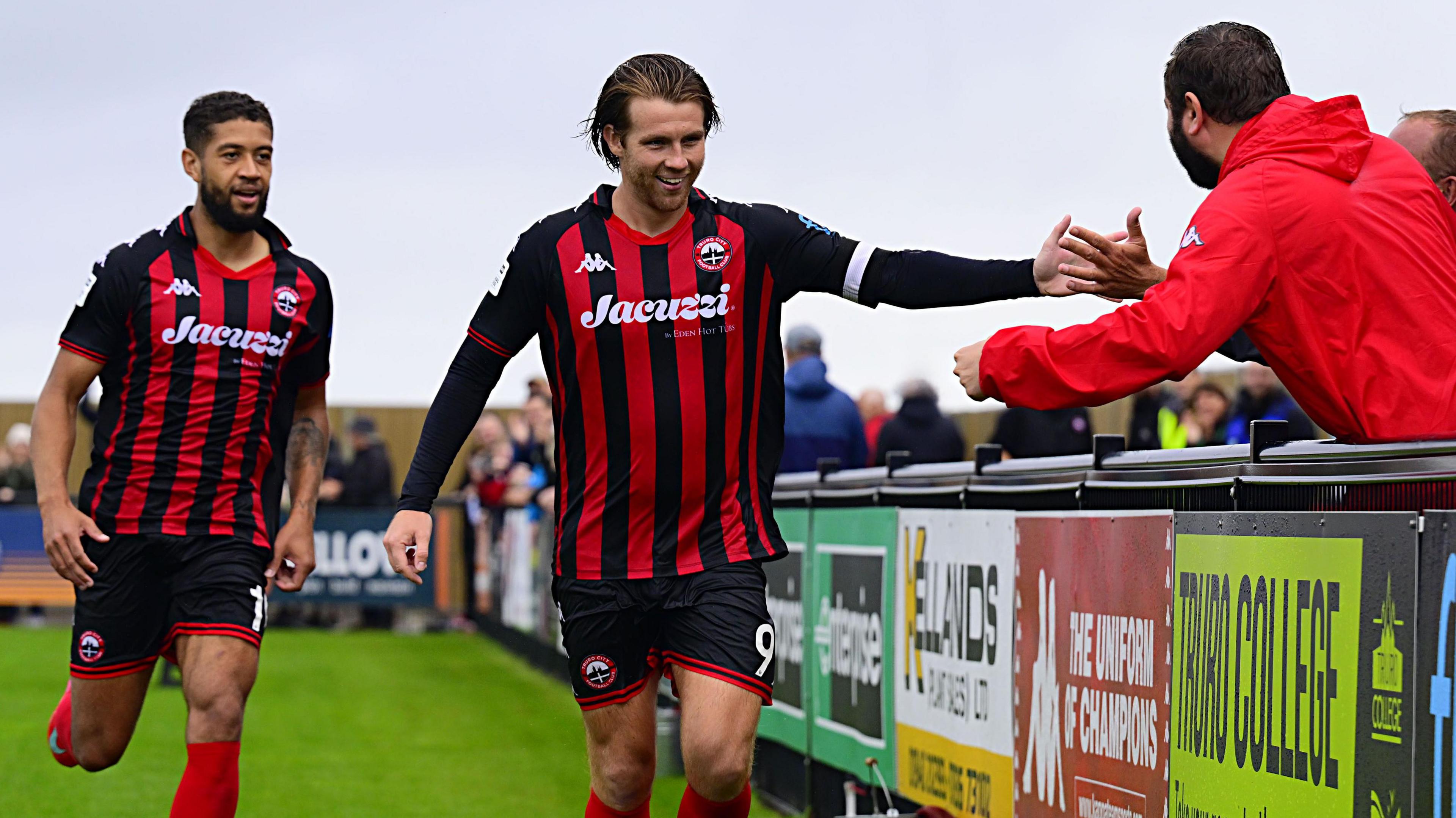 Footballer Tyler Harvey celebrating a goal for Truro City Football Club in the National League against Boston