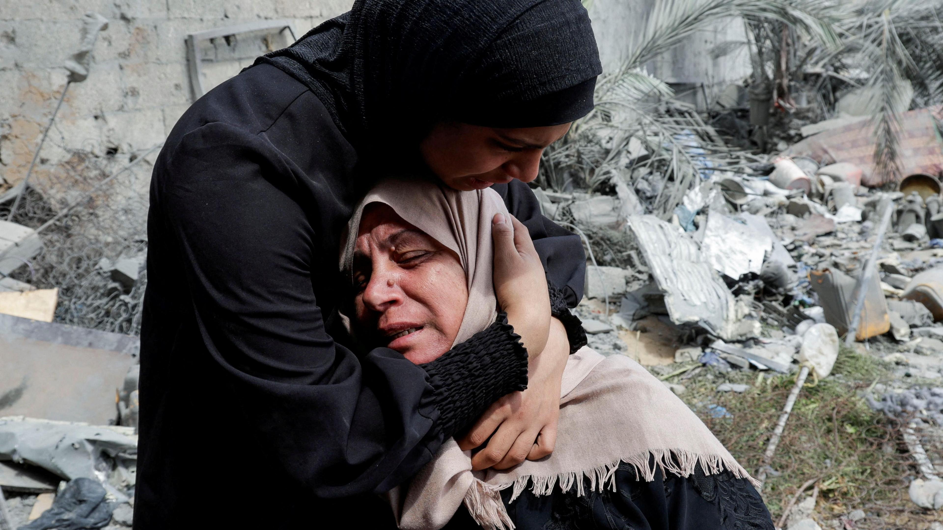 Naima, the grieving mother of Hala Zaarab, a Palestinian newlywed killed in an Israeli air strike, is comforted as she cries, in Khan Younis, southern Gaza, 3 May 2025