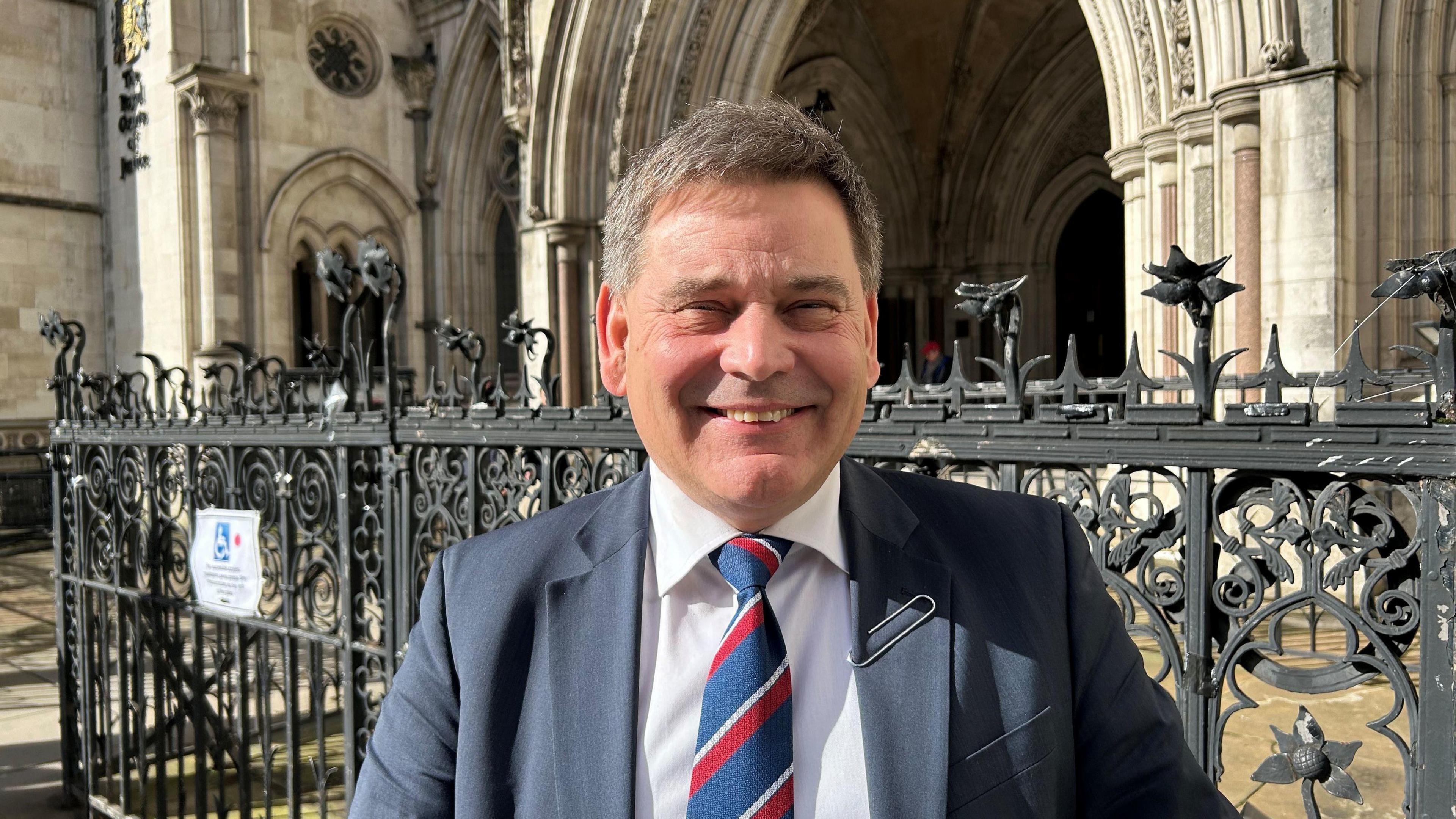 Andrew Bridgen standing outside the Royal Courts of Justice