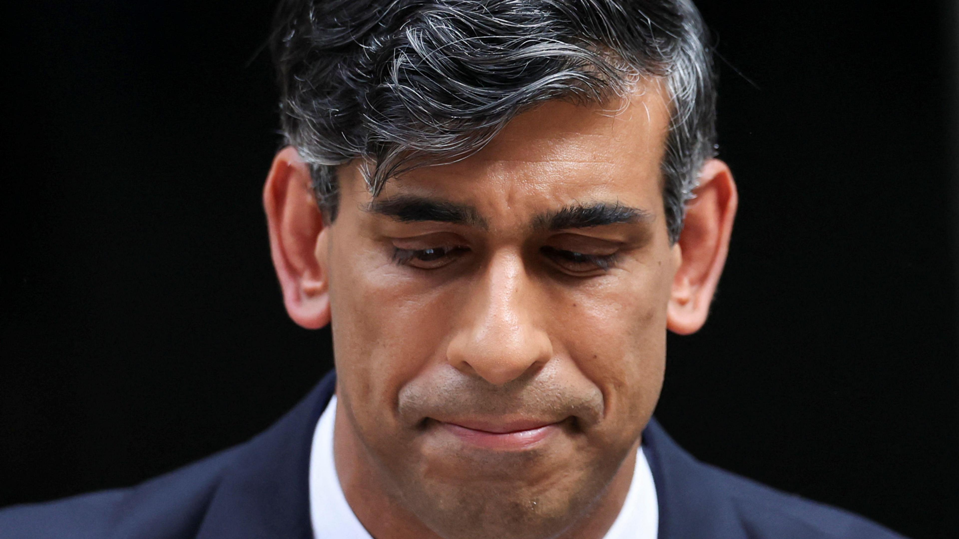 Rishi Sunak concedes defeat in the July general election with a downcast expression