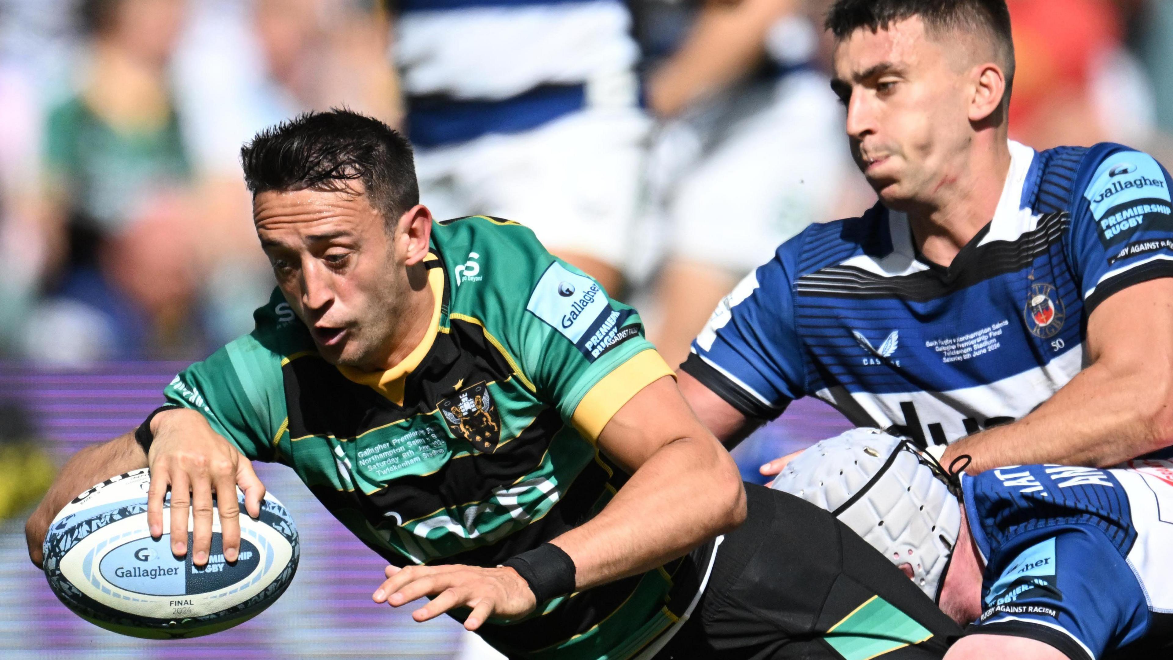 Northampton Saints scrum-half Alex Mitchell dives forward with the ball to score the winning touchdown against Bath in the 2023-24 Premiership final