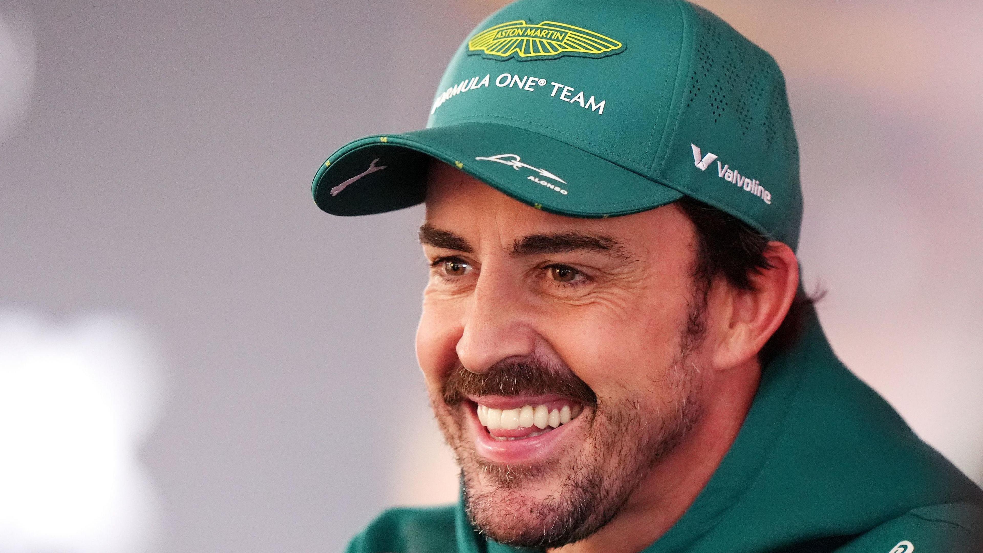 A smiling Fernando Alonso being interviewed after Dutch Grand Prix second practice