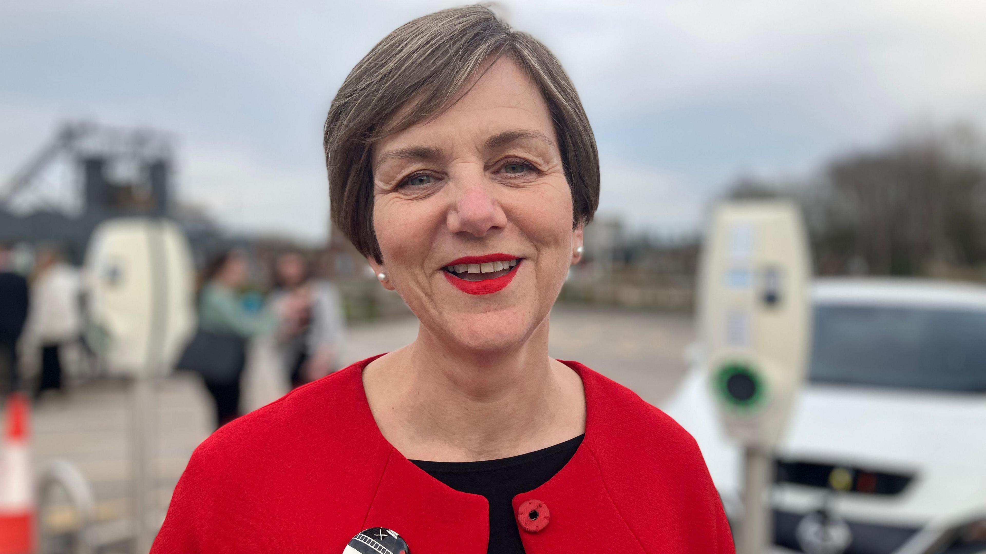 An image of Lilian Greenwood wearing a red jacket