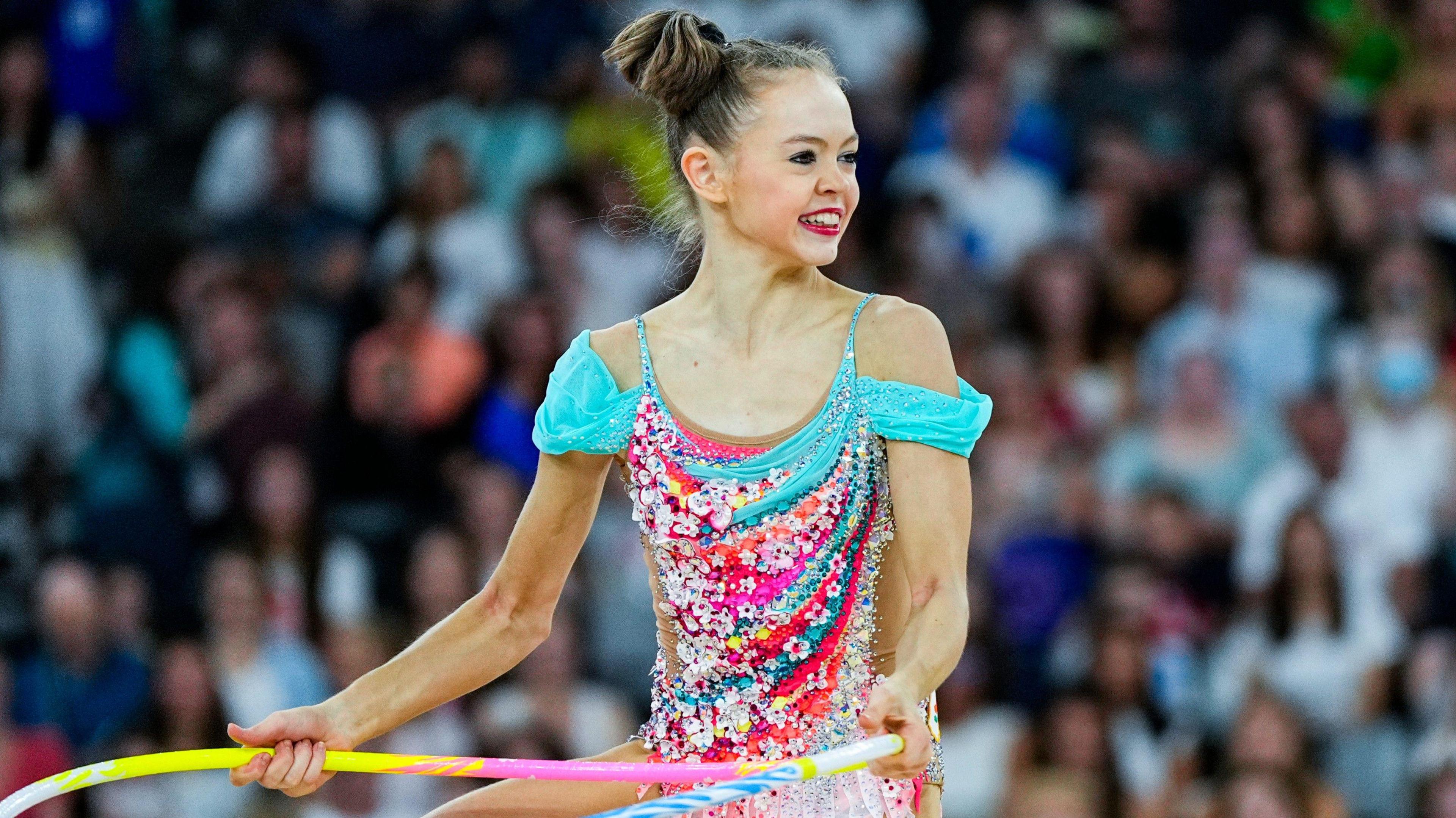 Vera Tugolukova of Cyprus performs with the hoop during the 2024 Olympics in Paris