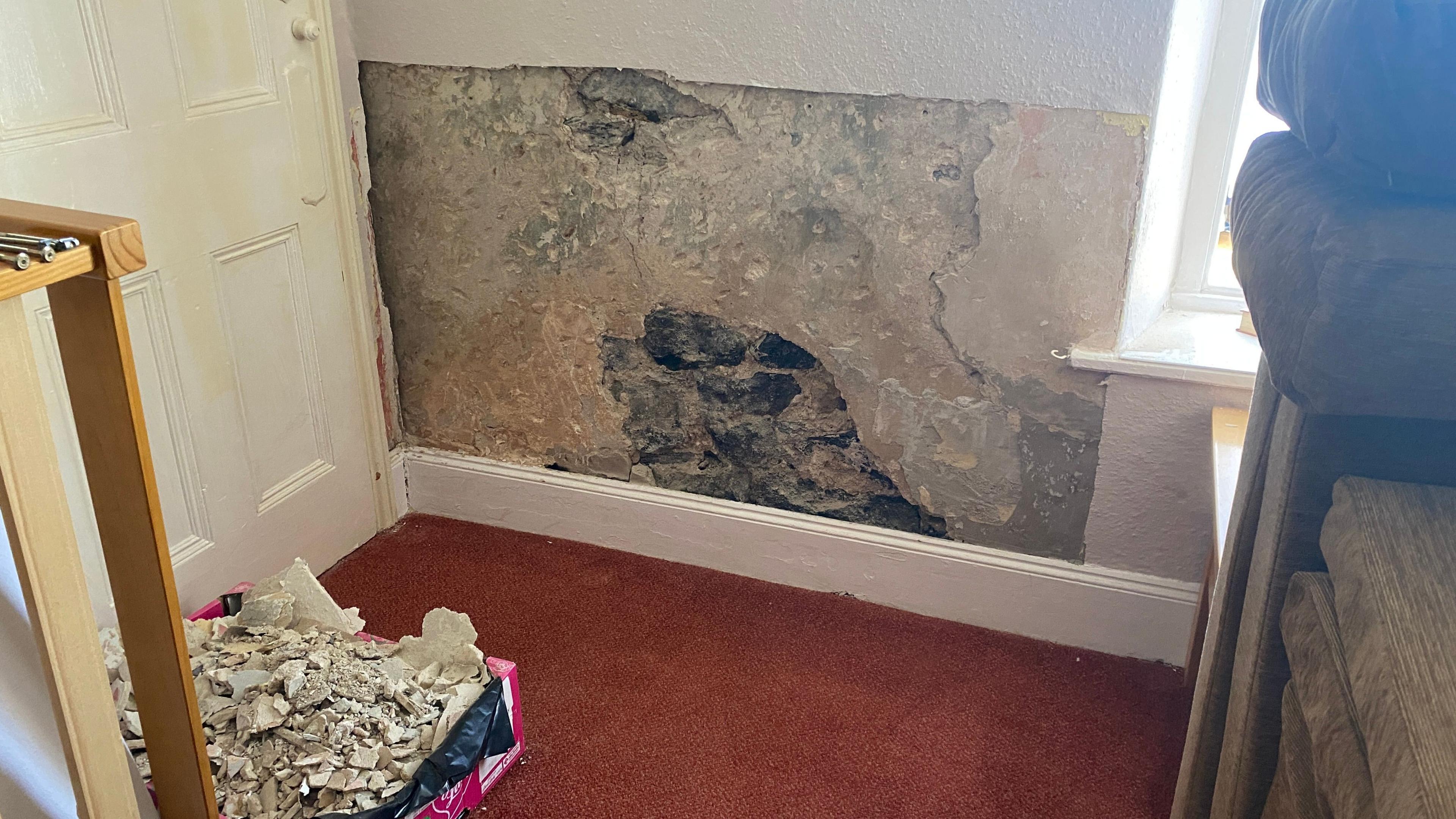 A patch of damp on the walls 