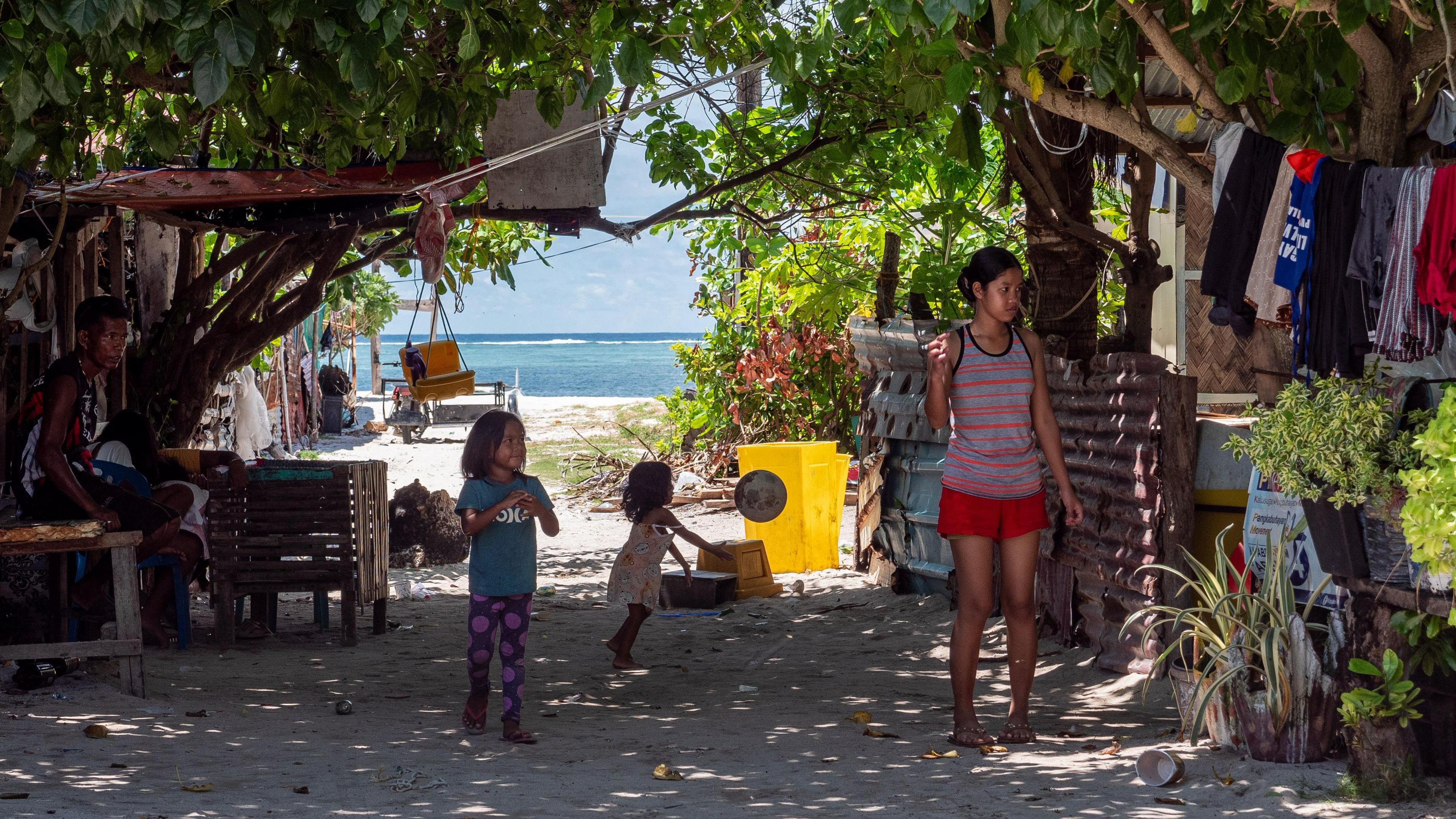Small children play on the island of Pagasa