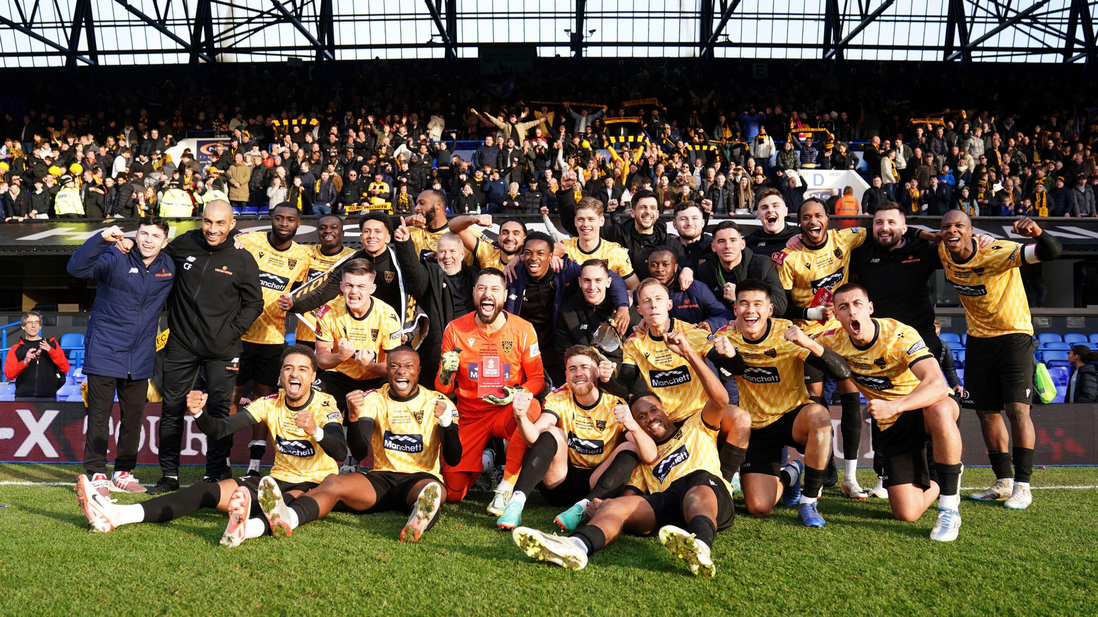 File photo dated 27-01-2024 of Maidstone United players and staff celebrate the win. National League South outfit Maidstone stunned Championship high-flyers Ipswich with a 2-1 victory to secure their place in the fifth round of the FA Cup.