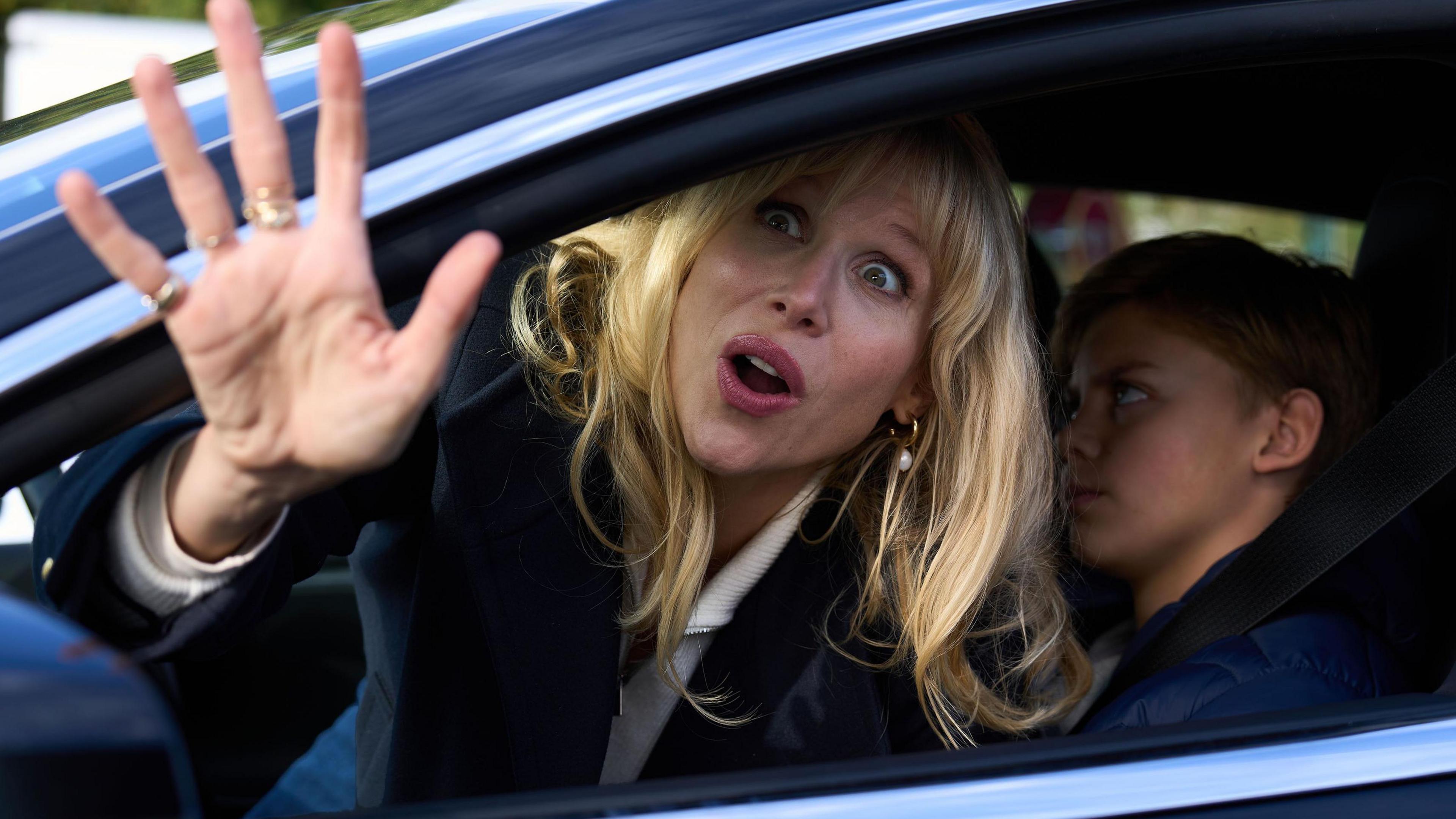 Promo image from Amandaland showing its titular star waving out of a car window