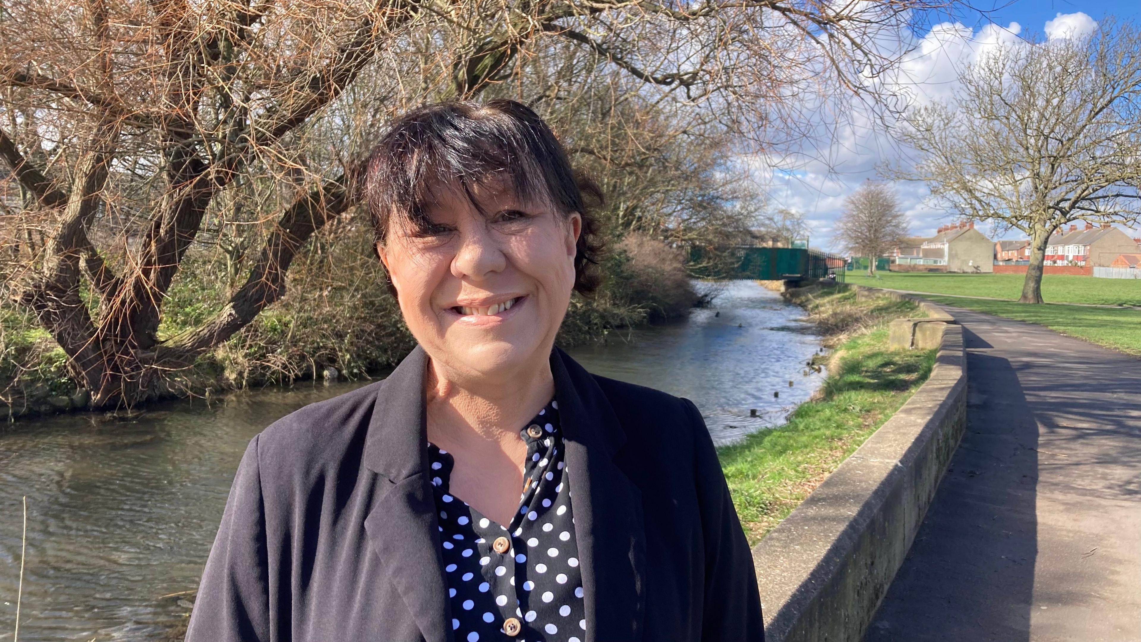 Labour's Lara Chaplin standing in front of a river in a park