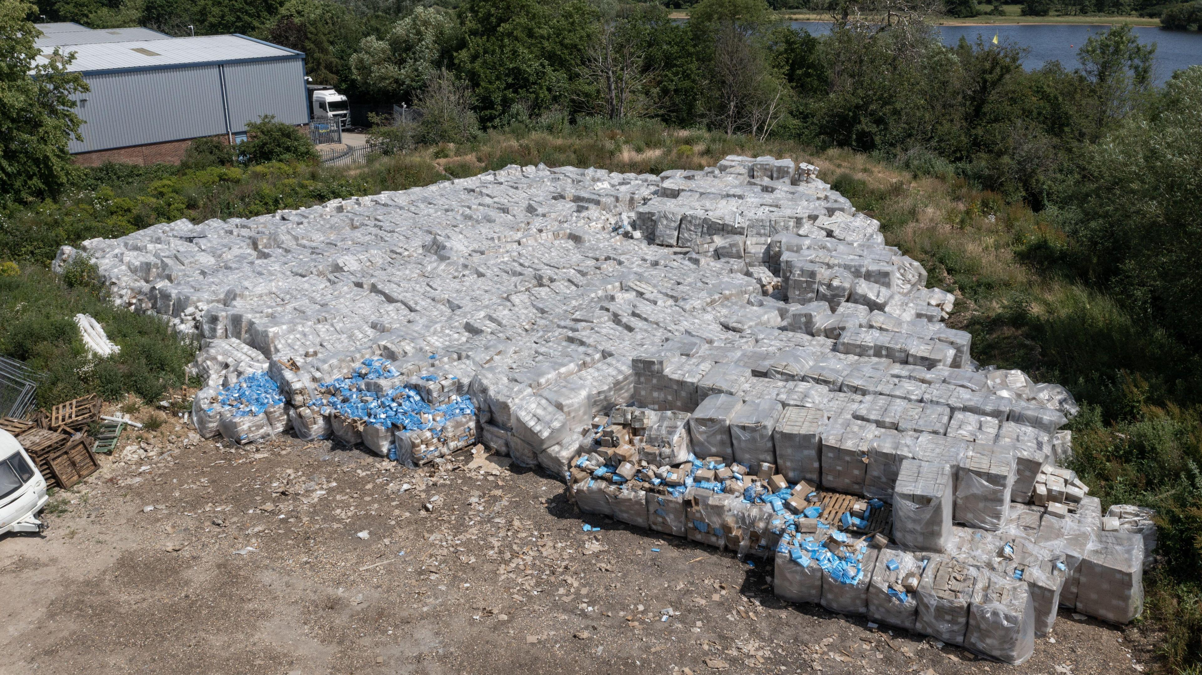 Aerial view of large amount of PPE dumped on a farm 