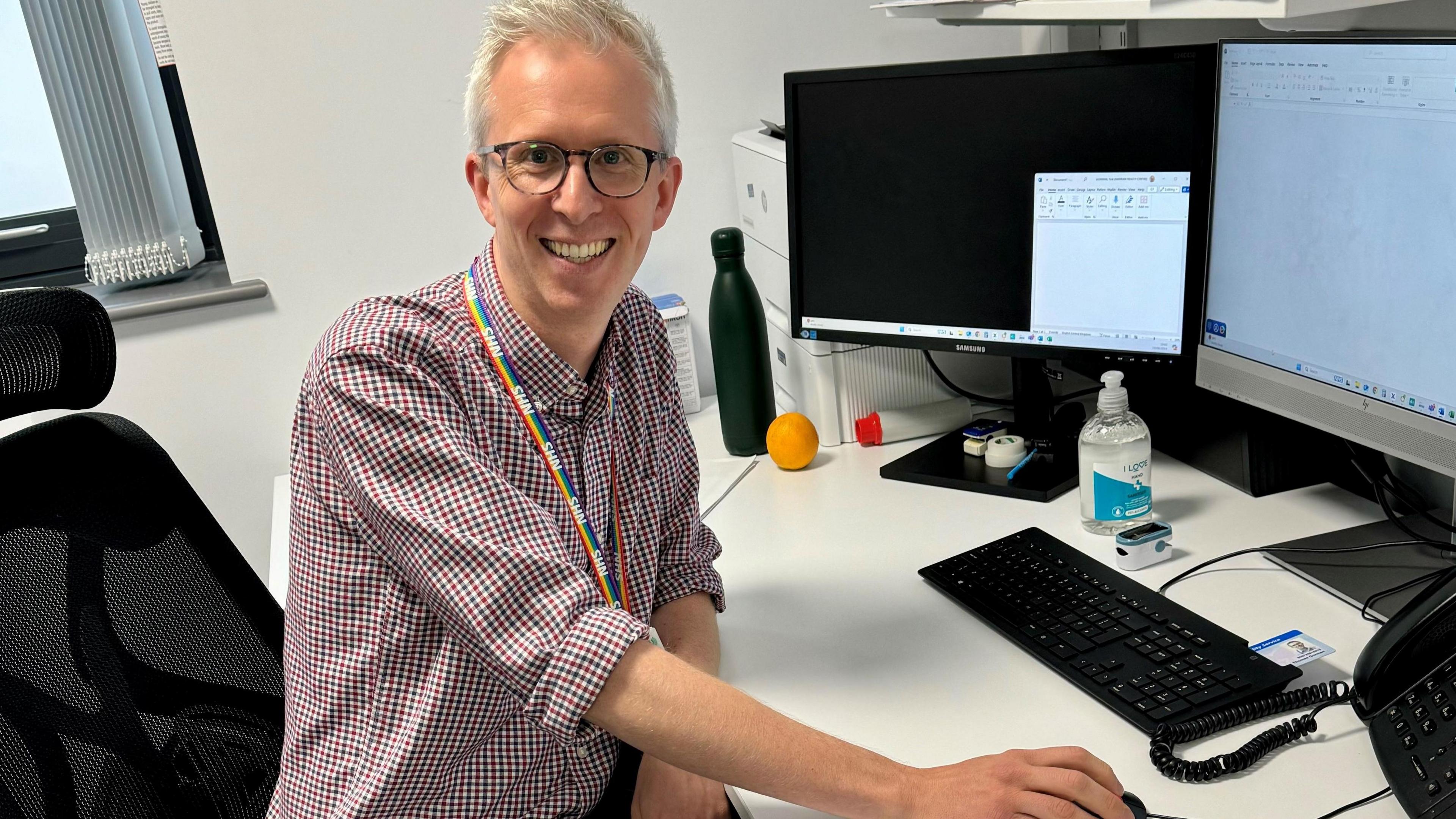 Dr Tom Gorman at his desk