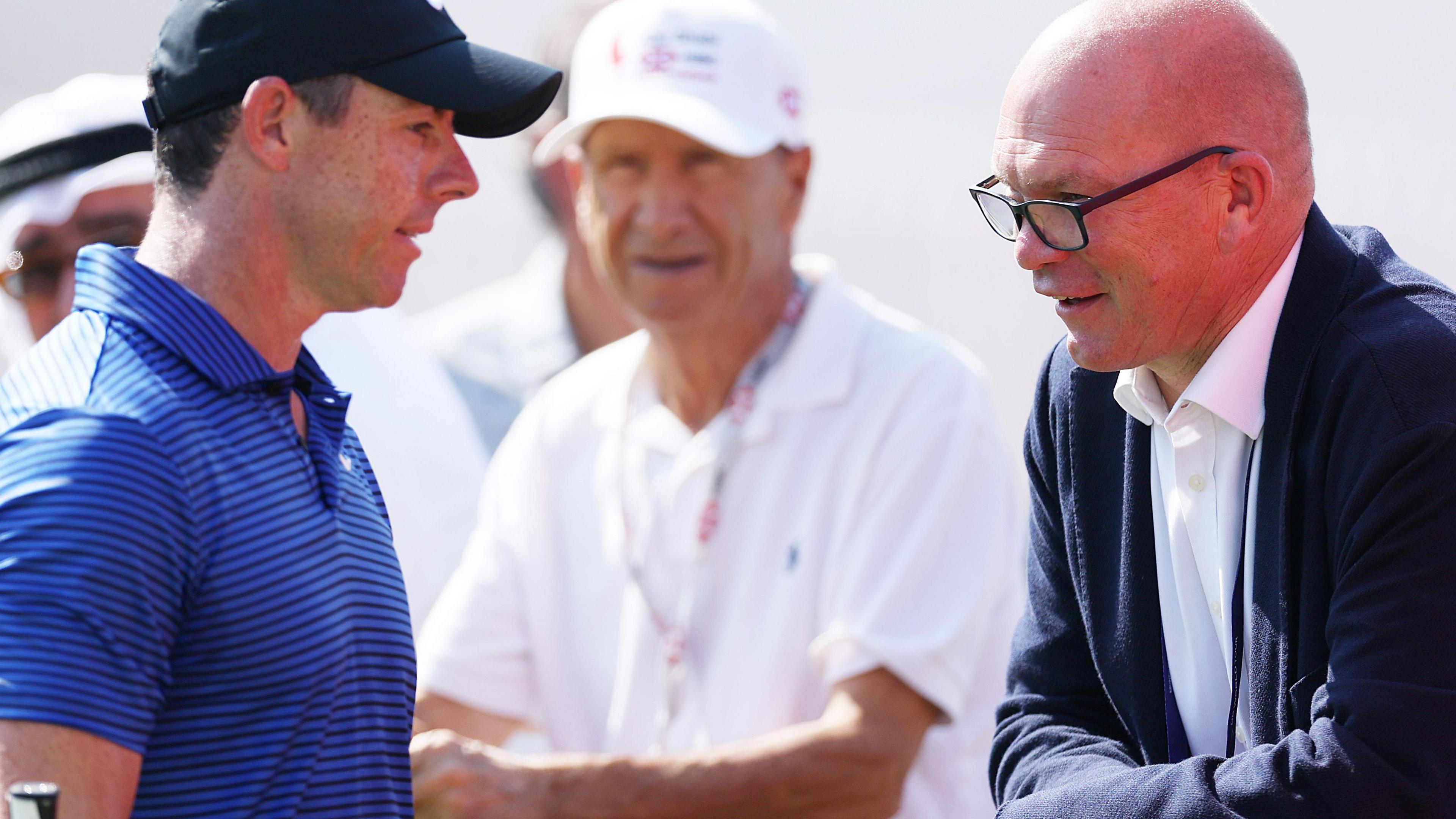Rory McIlroy chatting to DP World Tour chief executive Guy Kinnings