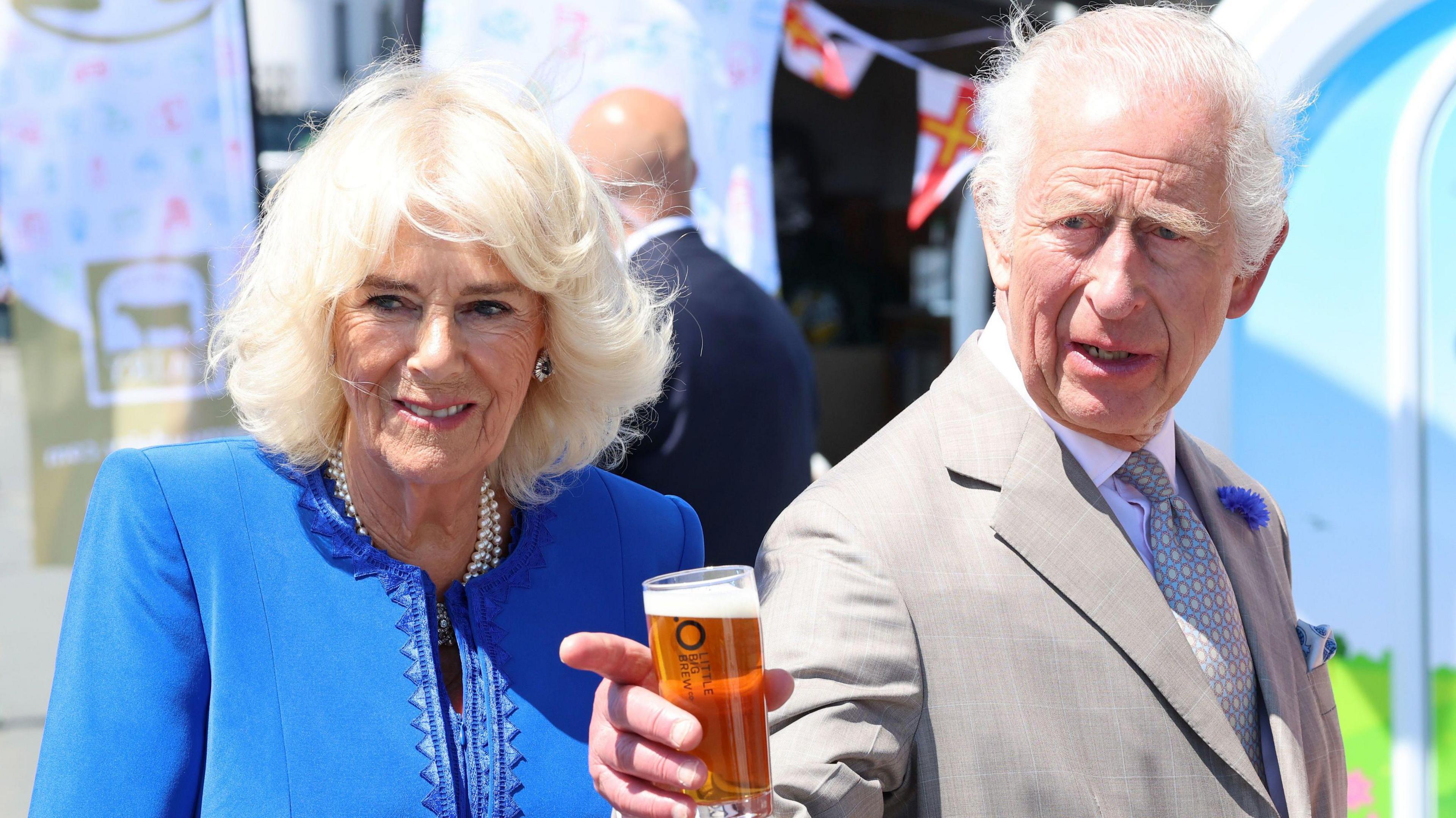 King Charles III and Queen Camilla sample local ale while touring a showcase of Guernsey culture, heritage, produce and environmental initiatives