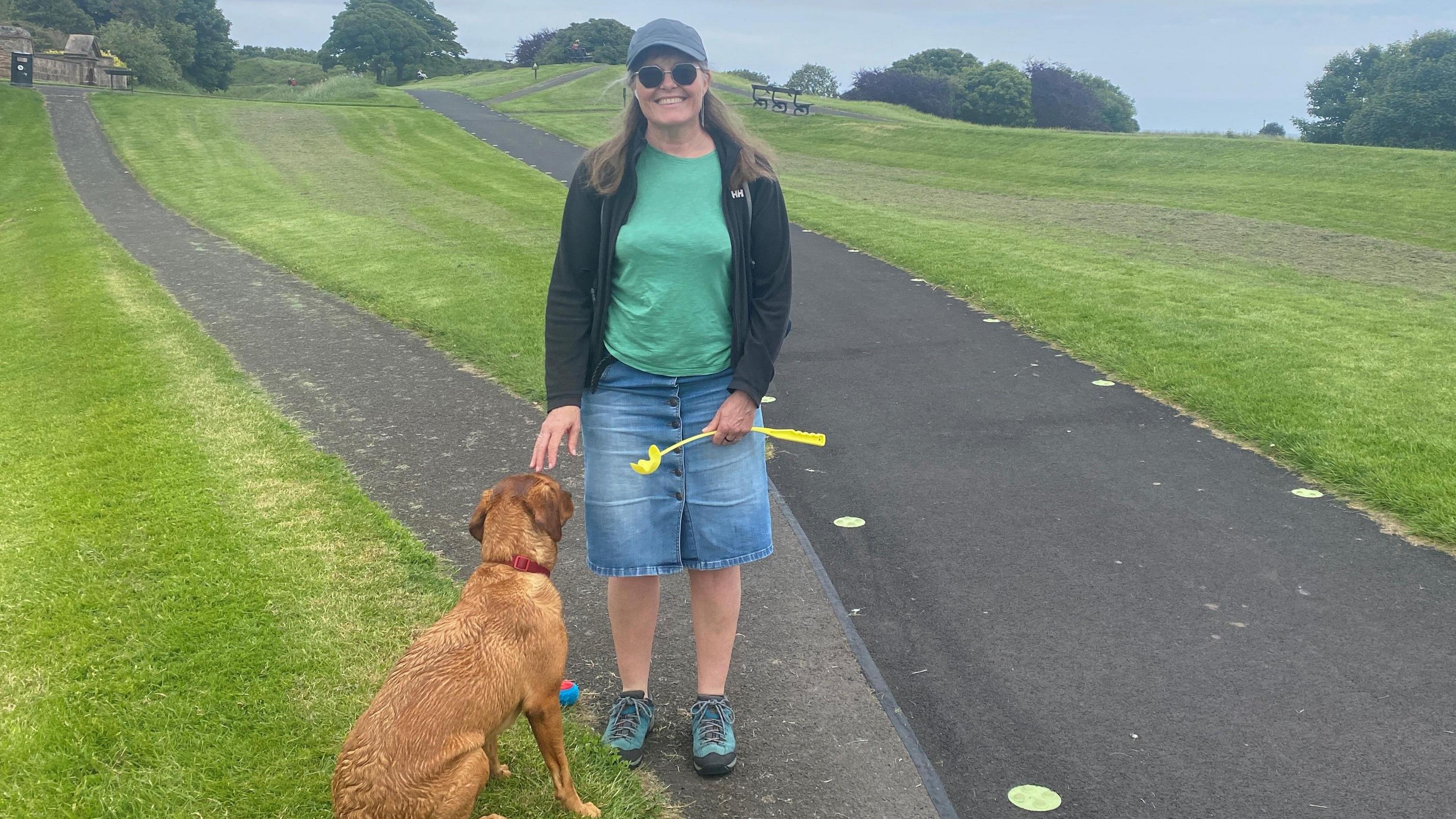 Kate Watson walking her dog Willow on Berwick's historic walls 