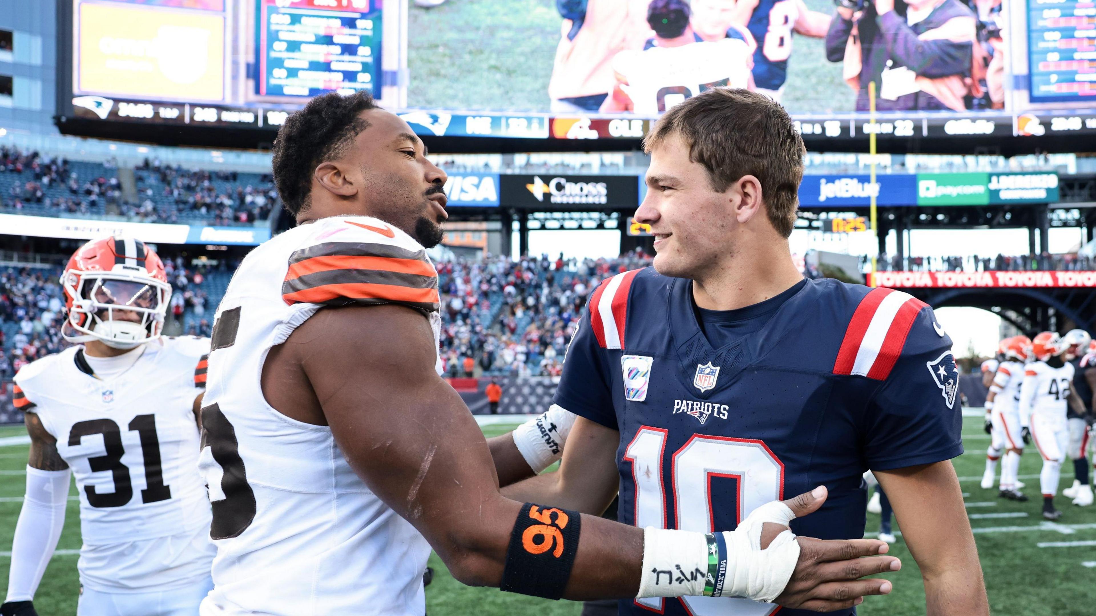Mayles Garrett and Drake Maye shake hands after Cleveland Browns faced the New England Patriots in the NFL
