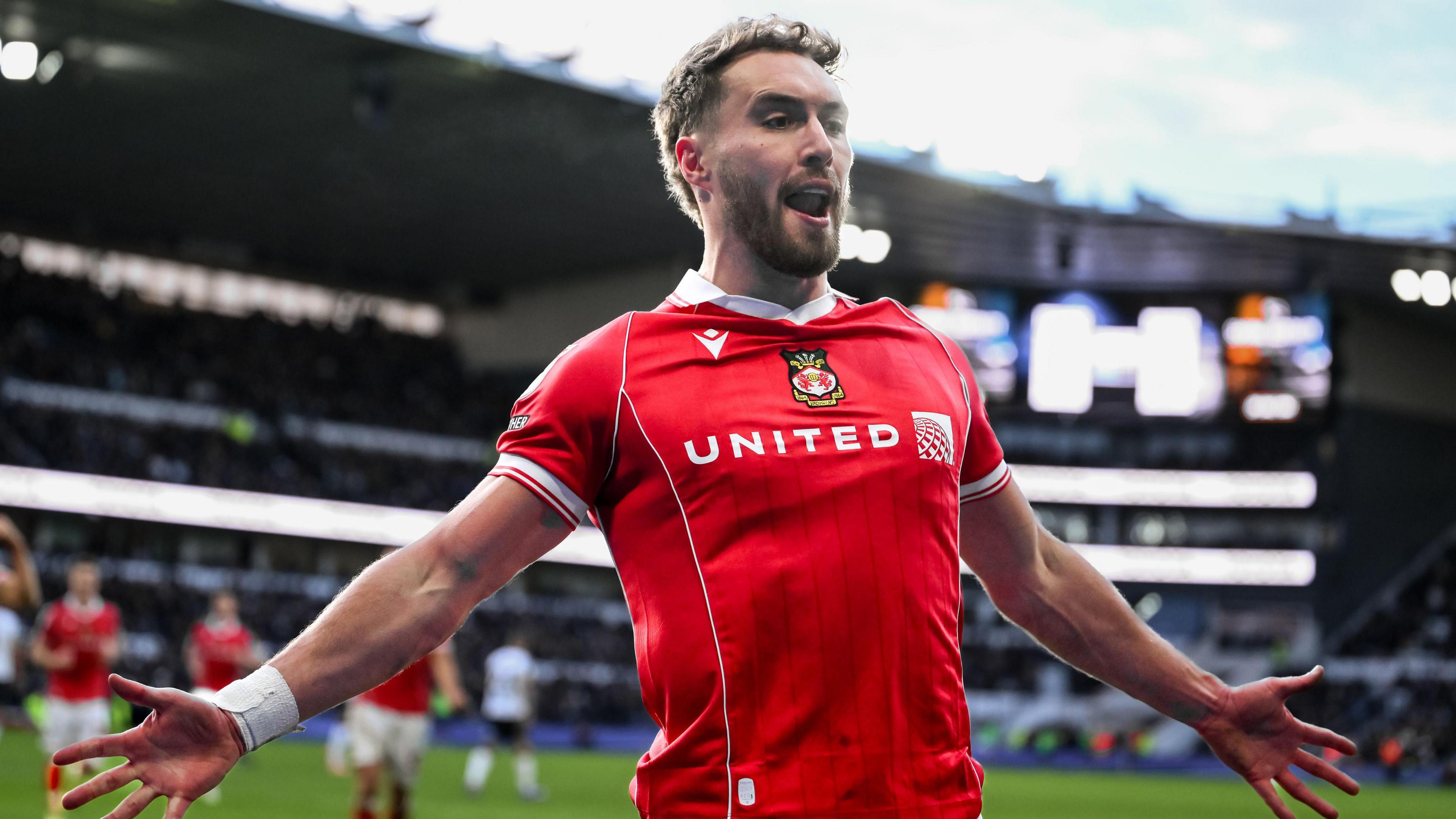 Sam Smith celebrates scoring for Wrexham
