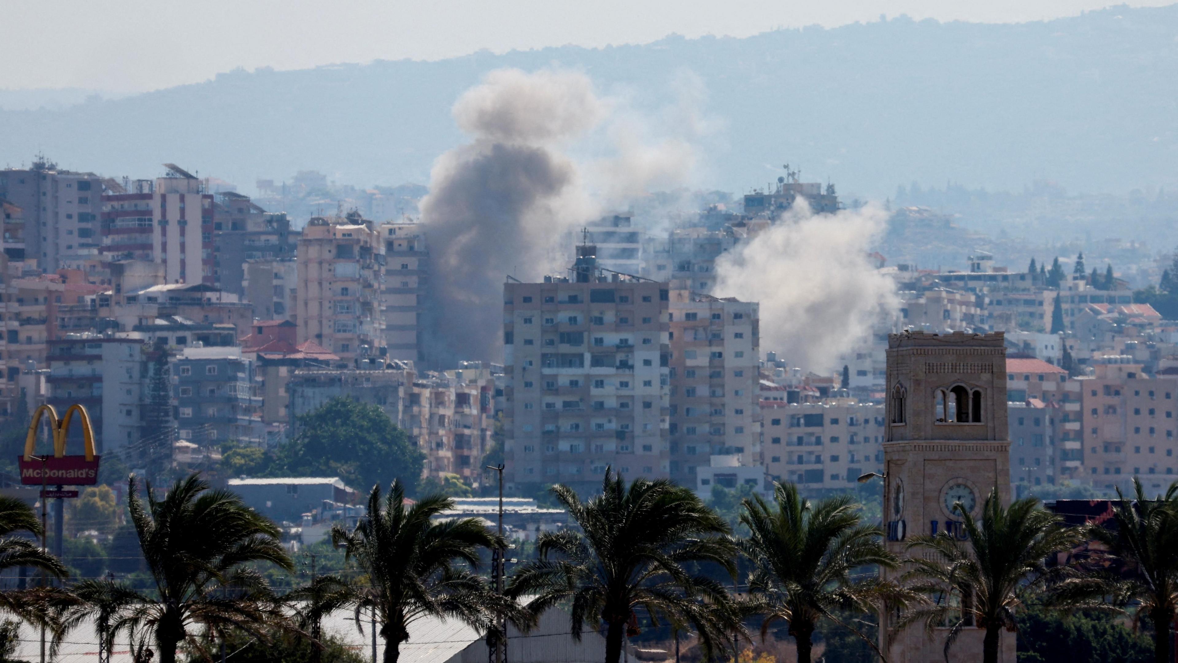 Smoke billows from buildings hit by an Israeli strike near Tyre, southern Lebanon (25 September 2024)