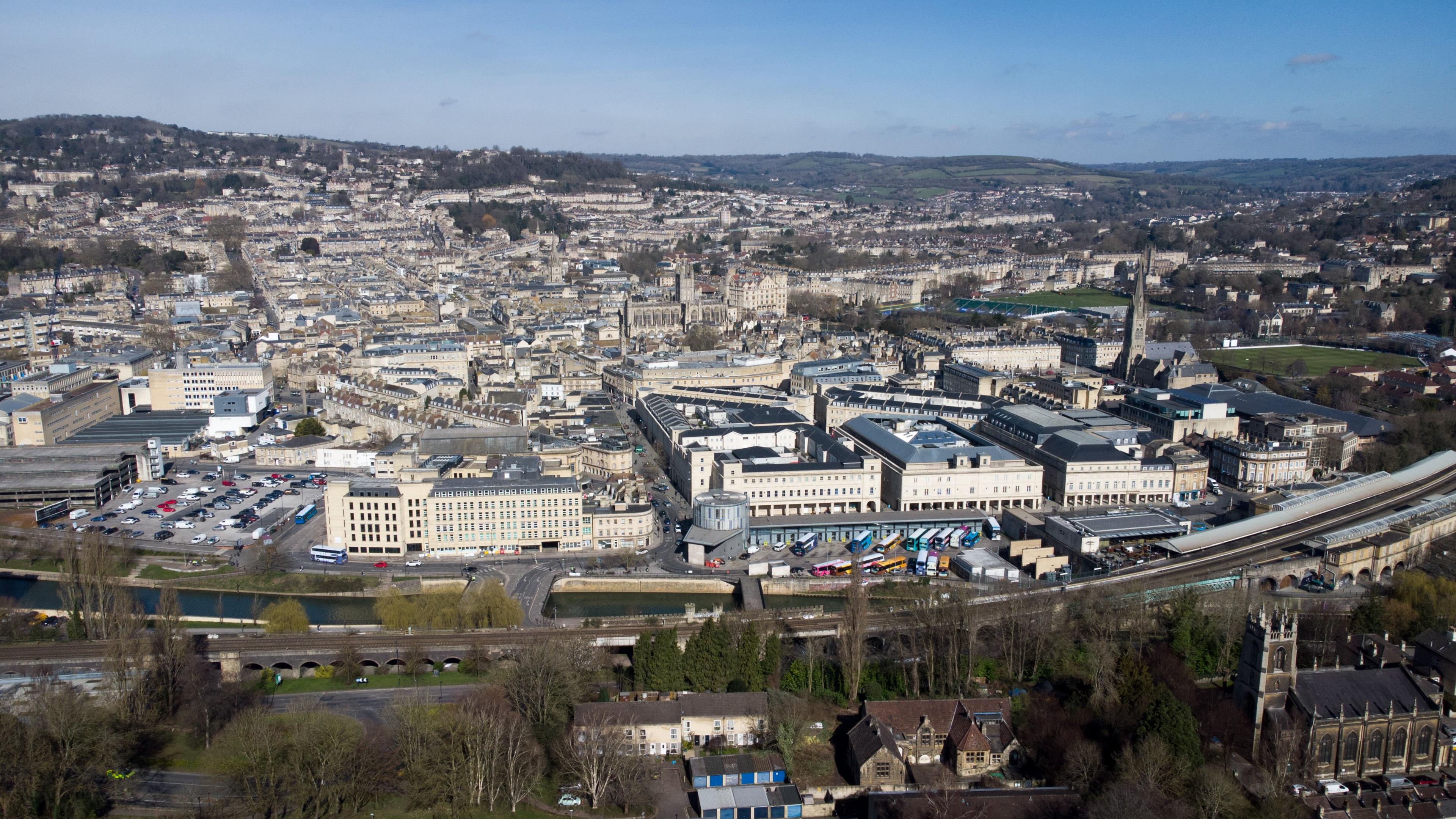 A drone shot of the Bath city scape. Buildings can be seen across the city.