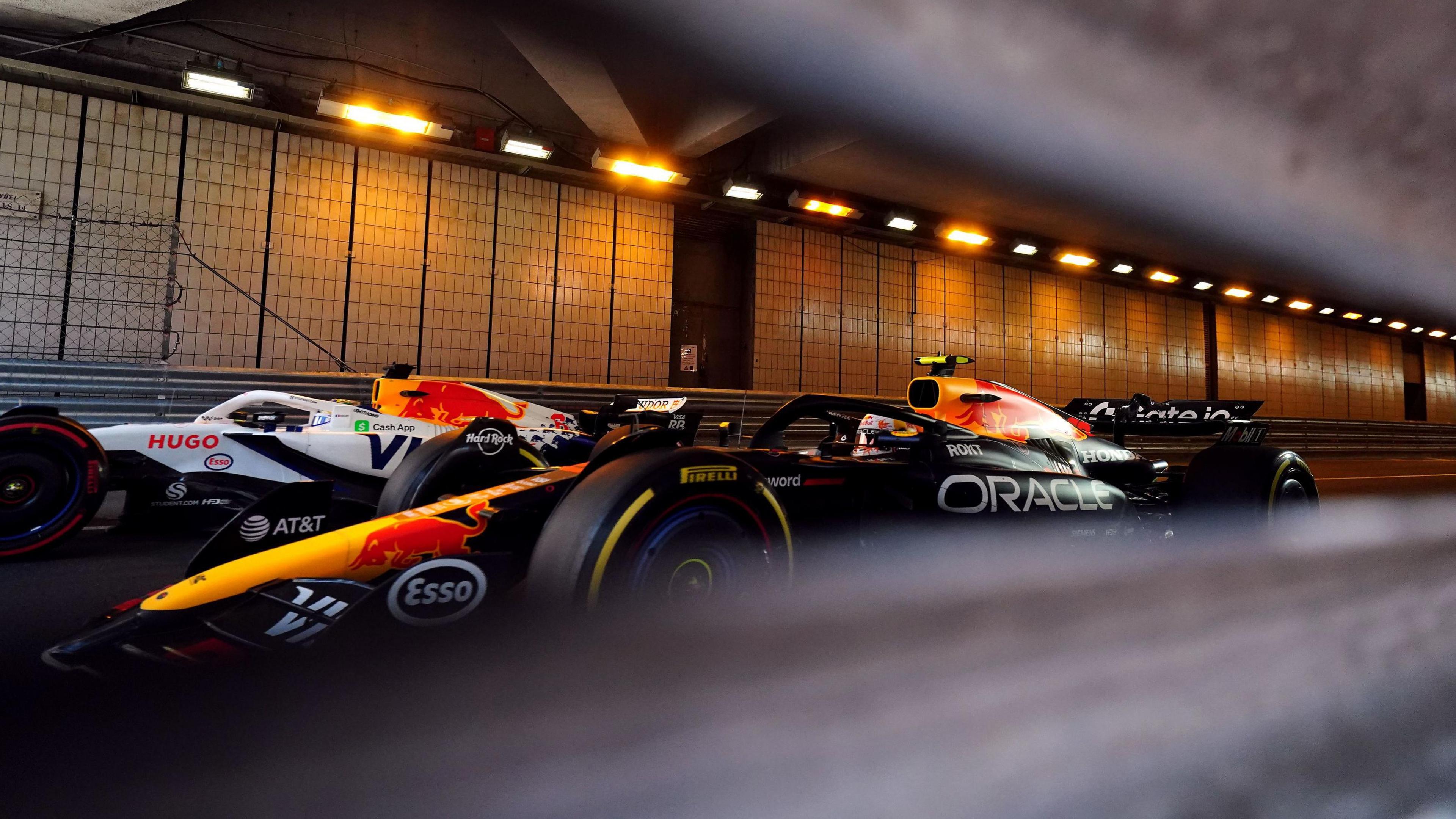 Red Bull's Yuki Tsunoda [right] and RB's Isack Hadjar in the tunnel during the third practice session
