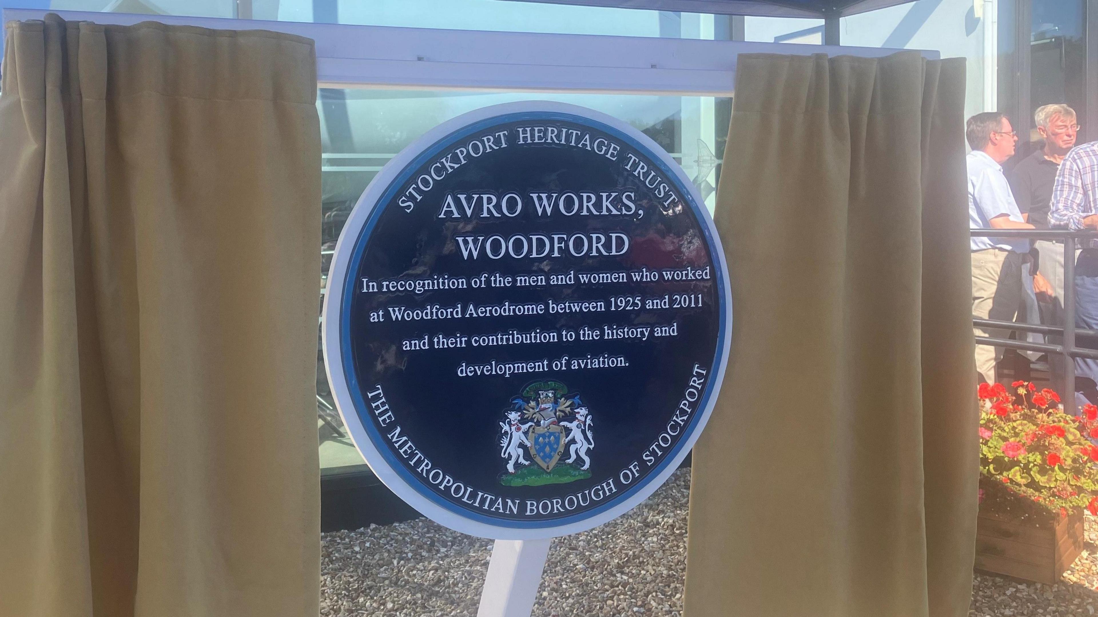 The plaque unveiled at the museum reads: "In recognition of the men and women who worked at the Woodford Aerodrome between 1925 and 2011 and their contribution to the history and development of aviation