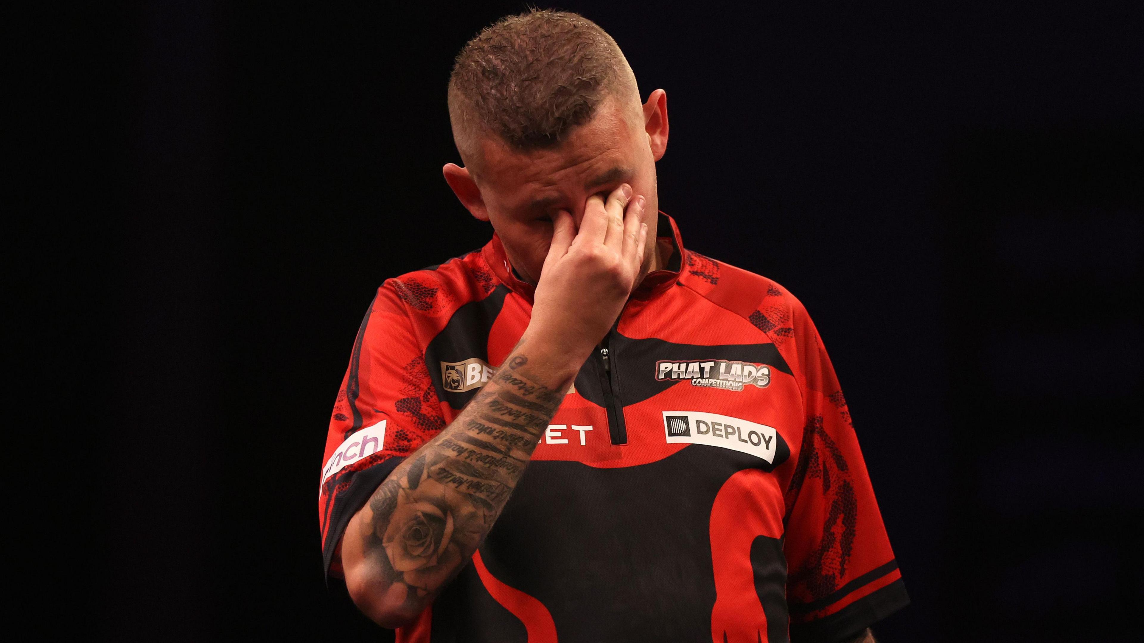 Nathan Aspinall looks dejected