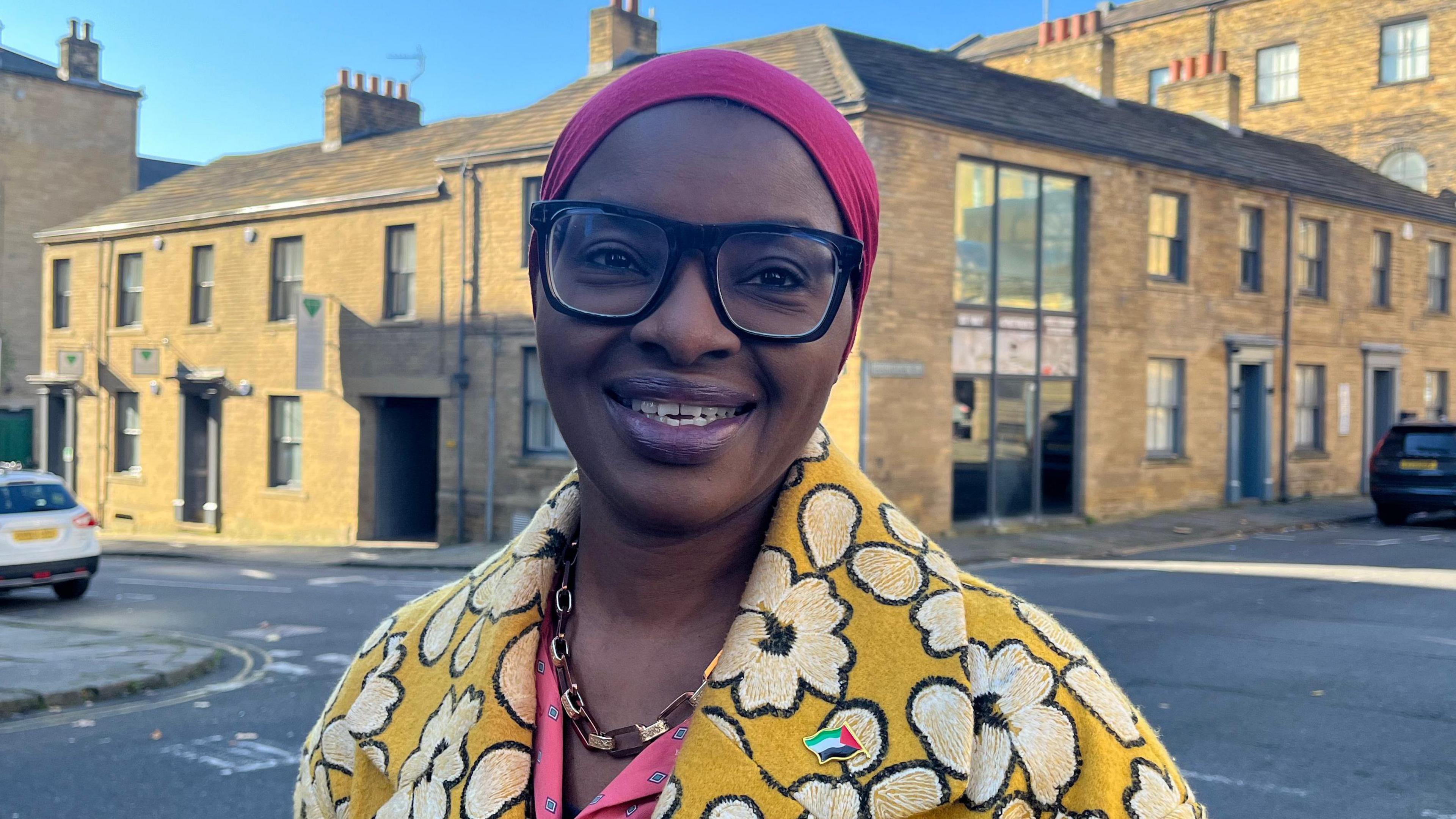 Lara Oyedele smiling in Little Germany, Bradford